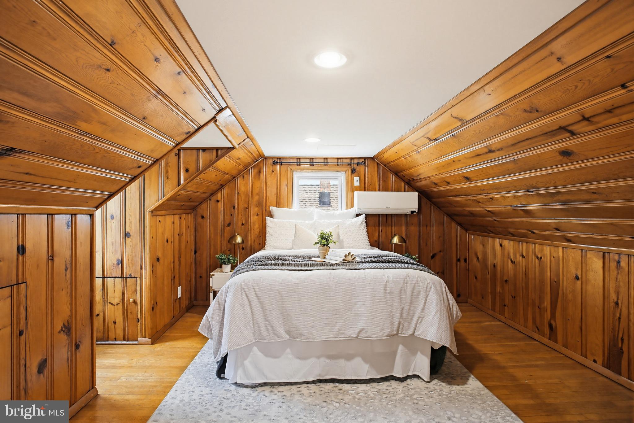 8209 Longpoint Road Baltimore, MD 21222 - Photo 22 of 37 a bedroom with a bed and wooden floor