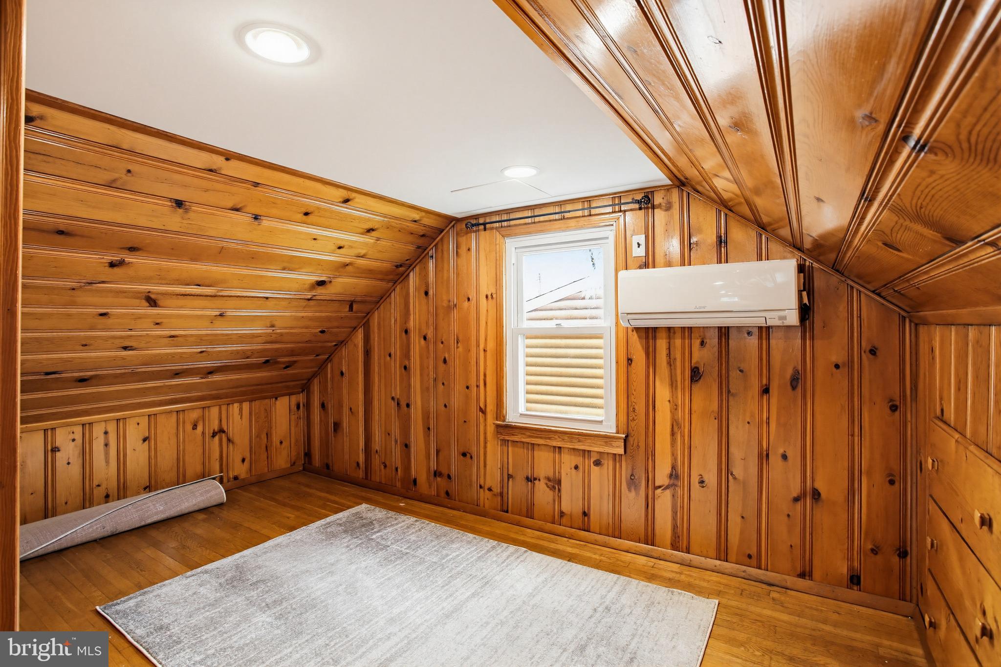 8209 Longpoint Road Baltimore, MD 21222 - Photo 24 of 37 a view of a room with wooden walls and stairs