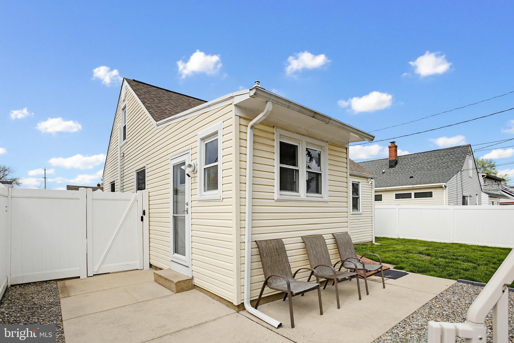 8209 Longpoint Road Baltimore, MD 21222 - Photo 30 of 37 a view of a house with yard and sitting area