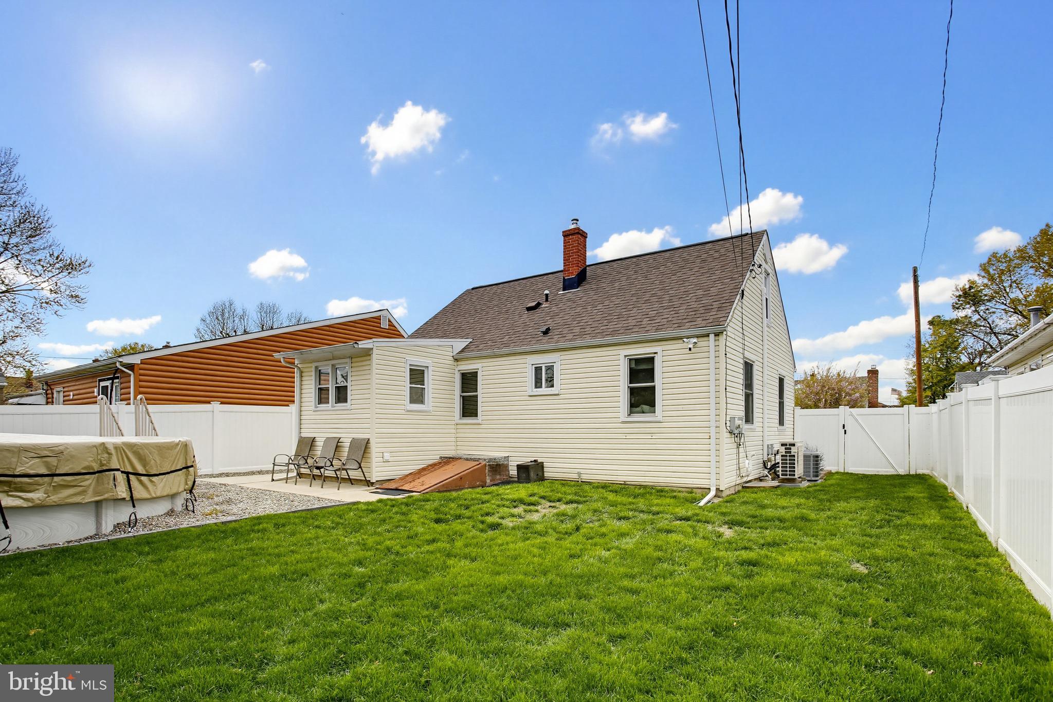 8209 Longpoint Road Baltimore, MD 21222 - Photo 33 of 37 a front view of a house with garden