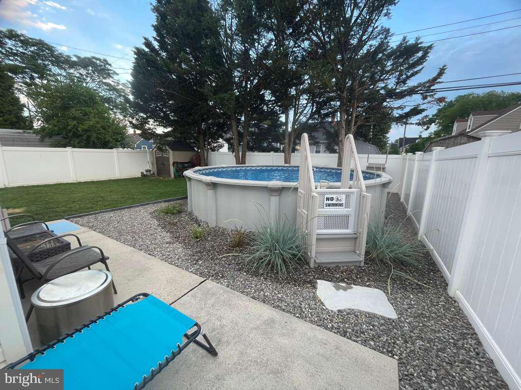 8209 Longpoint Road Baltimore, MD 21222 - Photo 34 of 37 a view of backyard of house with outdoor seating