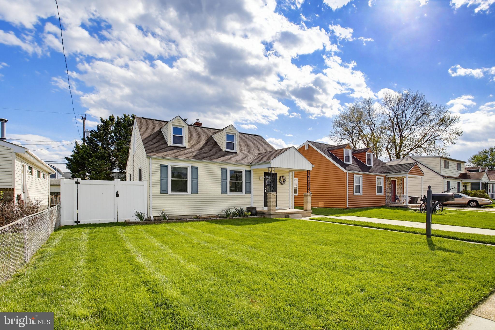 8209 Longpoint Road Baltimore, MD 21222 - Photo 37 of 37 a front view of a house with a garden