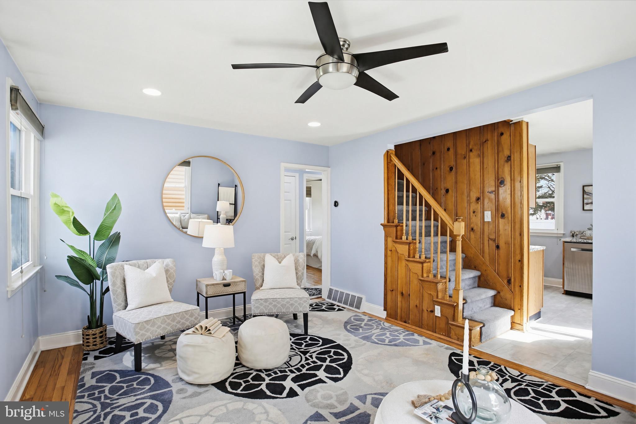 8209 Longpoint Road Baltimore, MD 21222 - Photo 5 of 37 a living room with furniture and a chandelier