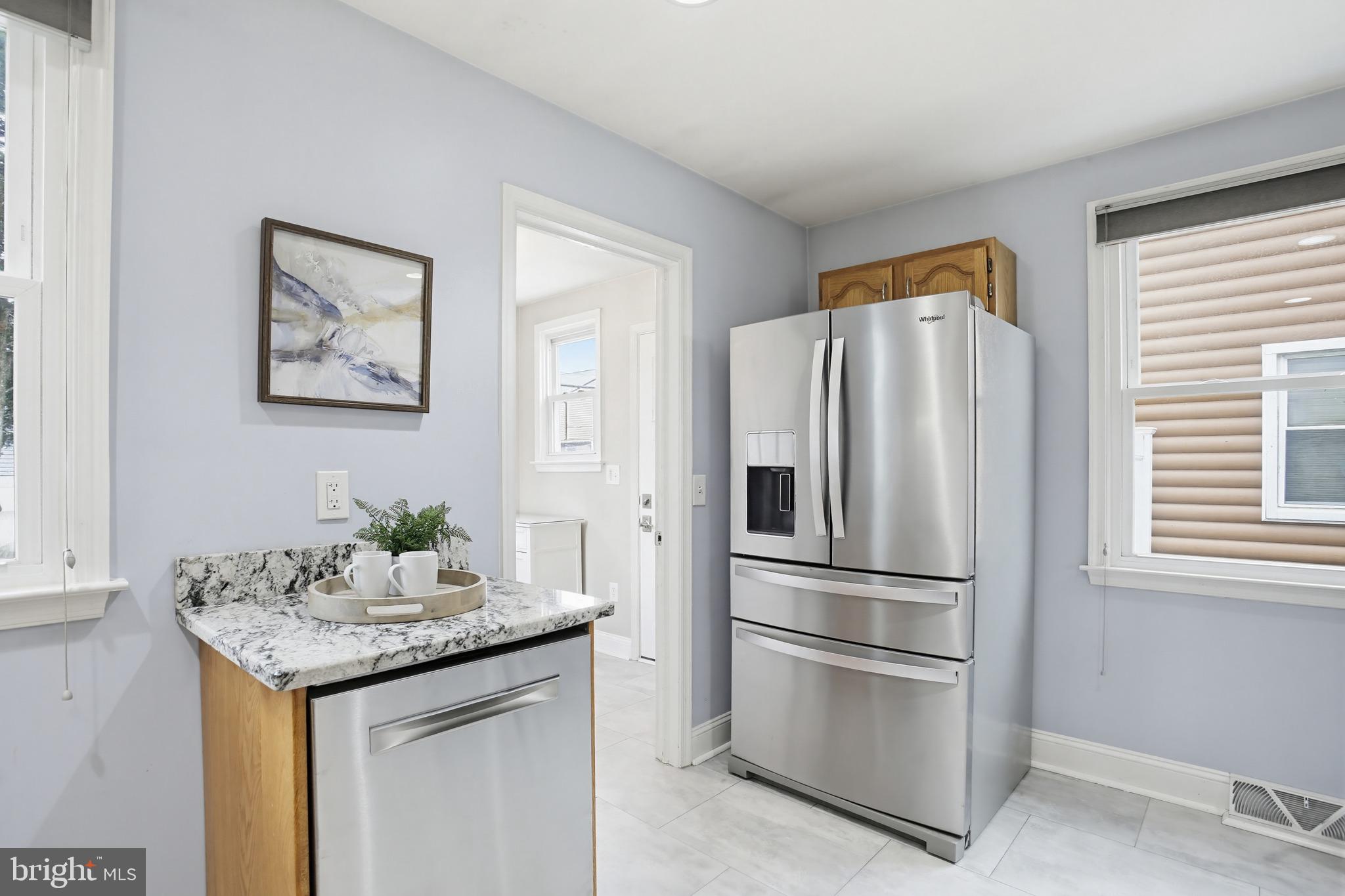 8209 Longpoint Road Baltimore, MD 21222 - Photo 10 of 37 a kitchen with stainless steel appliances granite countertop a refrigerator and a stove