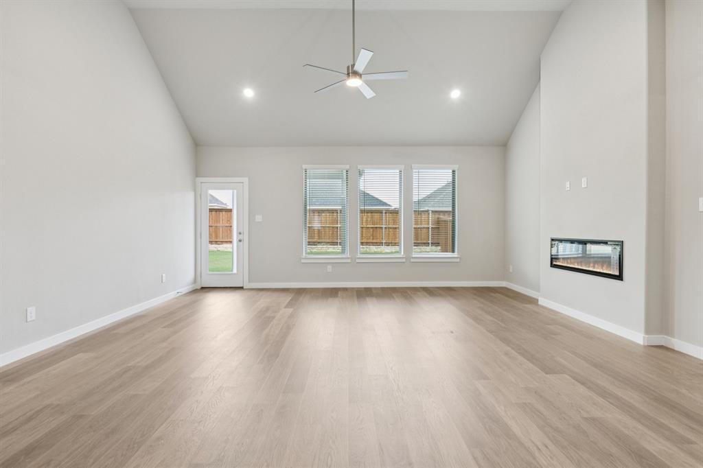 1464 Ranchero Rodeo Road Haslet, TX 76052 - Photo 13 of 33 Living and Dining Room in the Stanley II home plan by Trophy Signature Homes – REPRESENTATIVE PHO