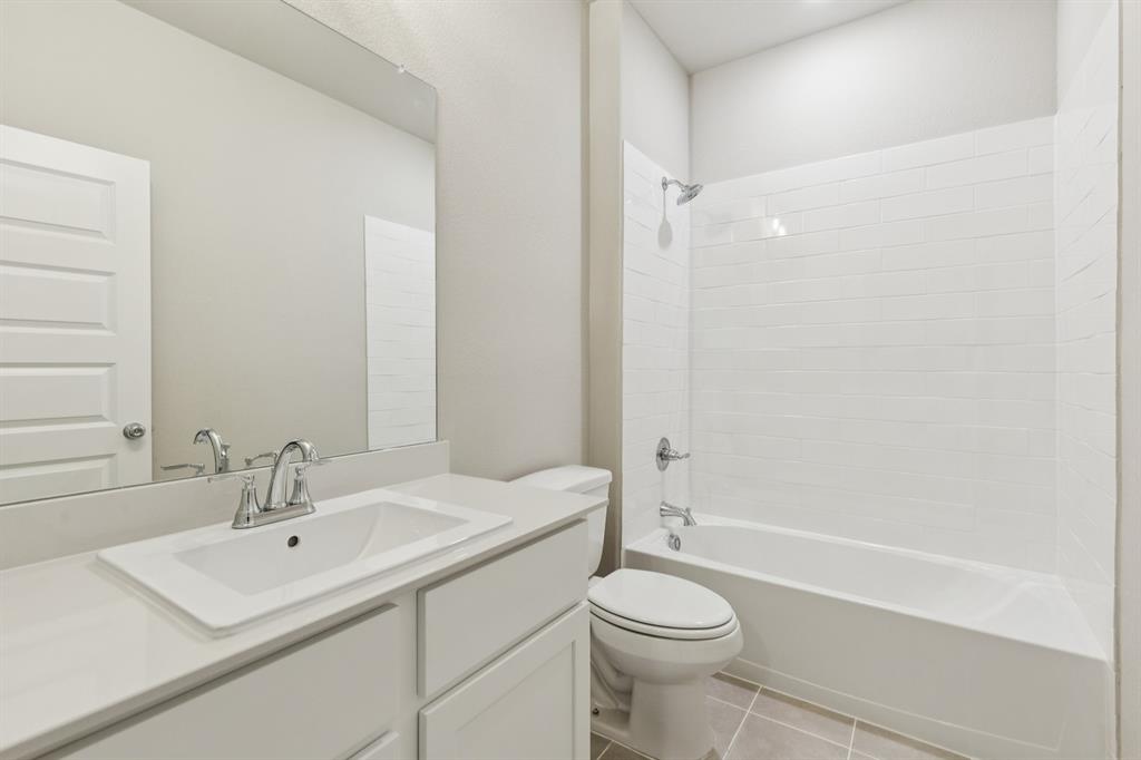 1464 Ranchero Rodeo Road Haslet, TX 76052 - Photo 27 of 33 Bathroom in the Stanley II home plan by Trophy Signature Homes – REPRESENTATIVE PHOTO