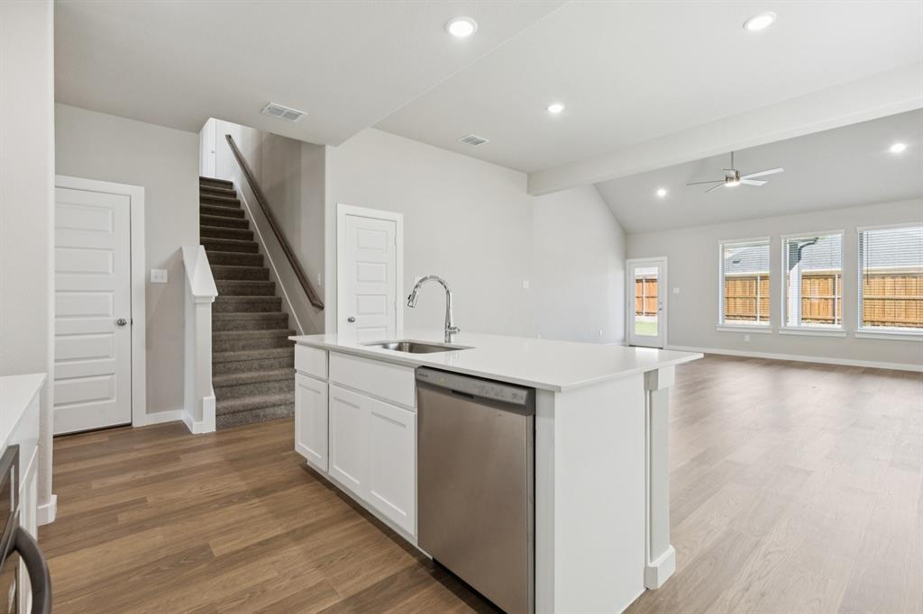 1464 Ranchero Rodeo Road Haslet, TX 76052 - Photo 9 of 33 Kitchen in the Stanley II home plan by Trophy Signature Homes – REPRESENTATIVE PHOTO