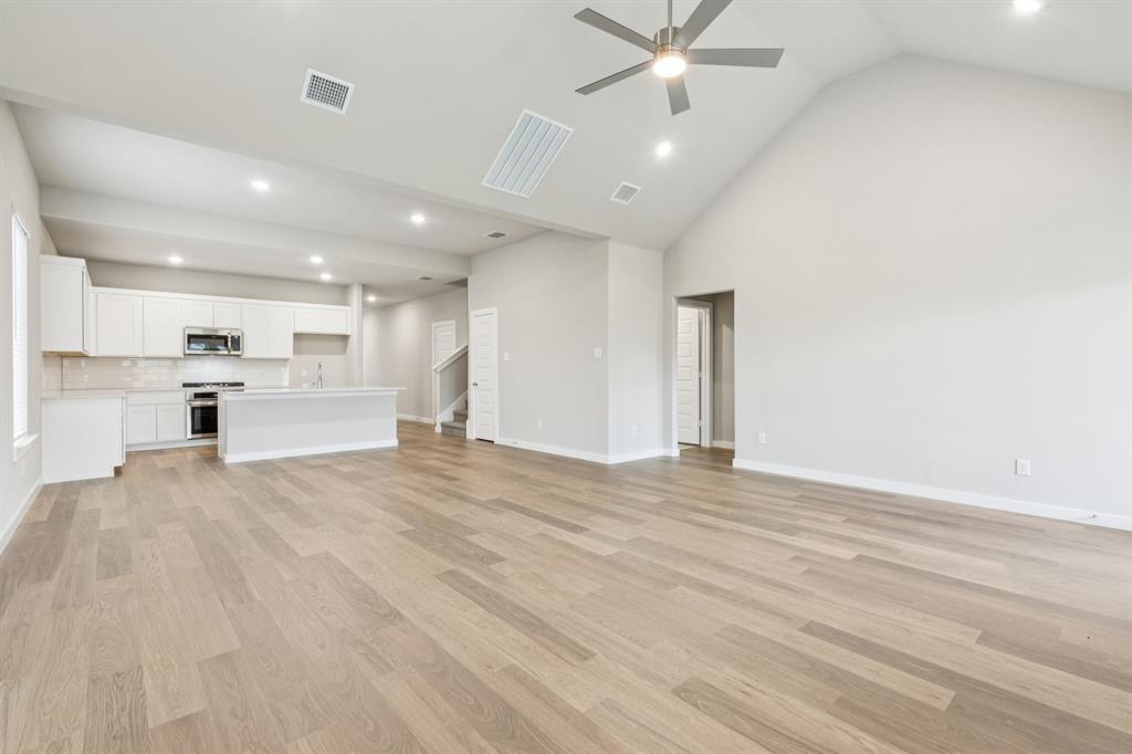 1464 Ranchero Rodeo Road Haslet, TX 76052 - Photo 10 of 33 First Floor in the Stanley II home plan by Trophy Signature Homes – REPRESENTATIVE PHOTO