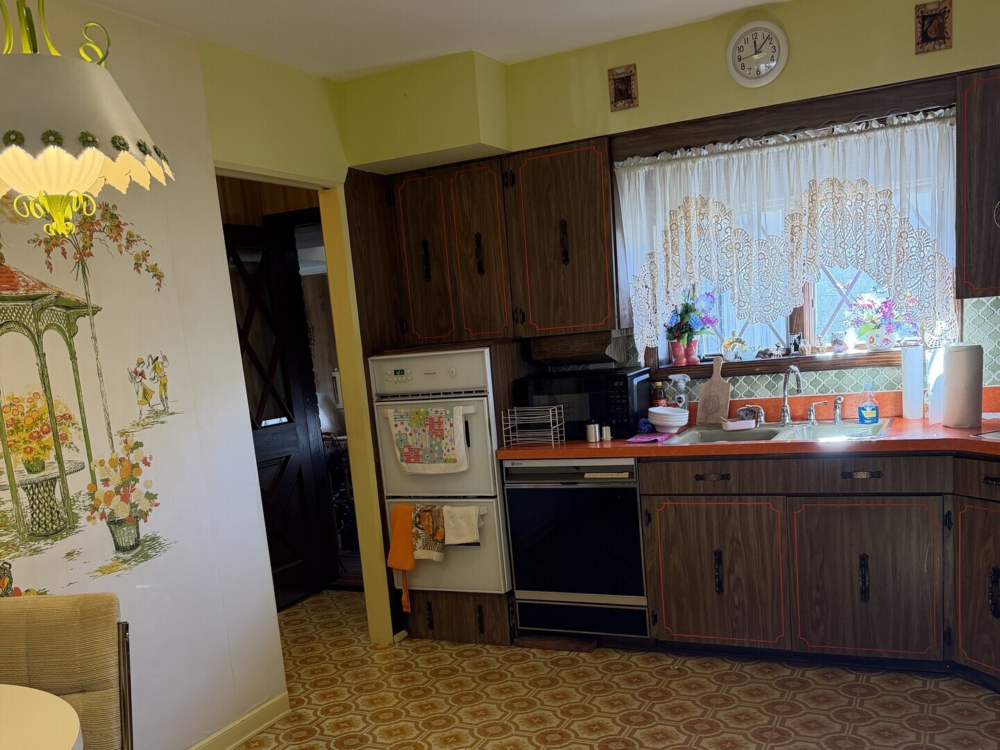9037 Chester Avenue Niles, IL 60714 - Photo 6 of 12 a kitchen with stainless steel appliances granite countertop a refrigerator and a stove