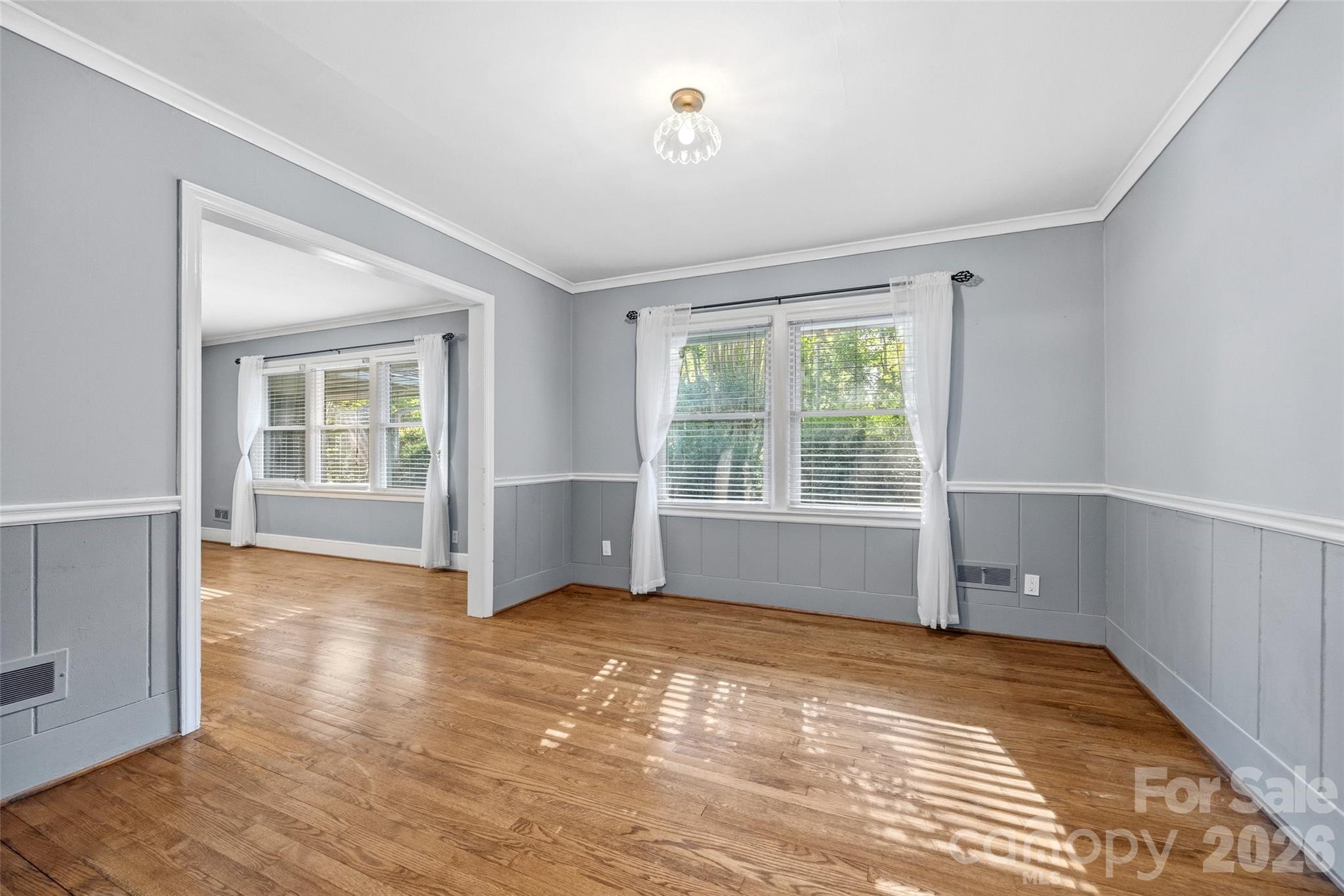 407 Pine Street Fort Mill, SC 29715 - Photo 12 of 45 a view of an empty room with wooden floor and a window