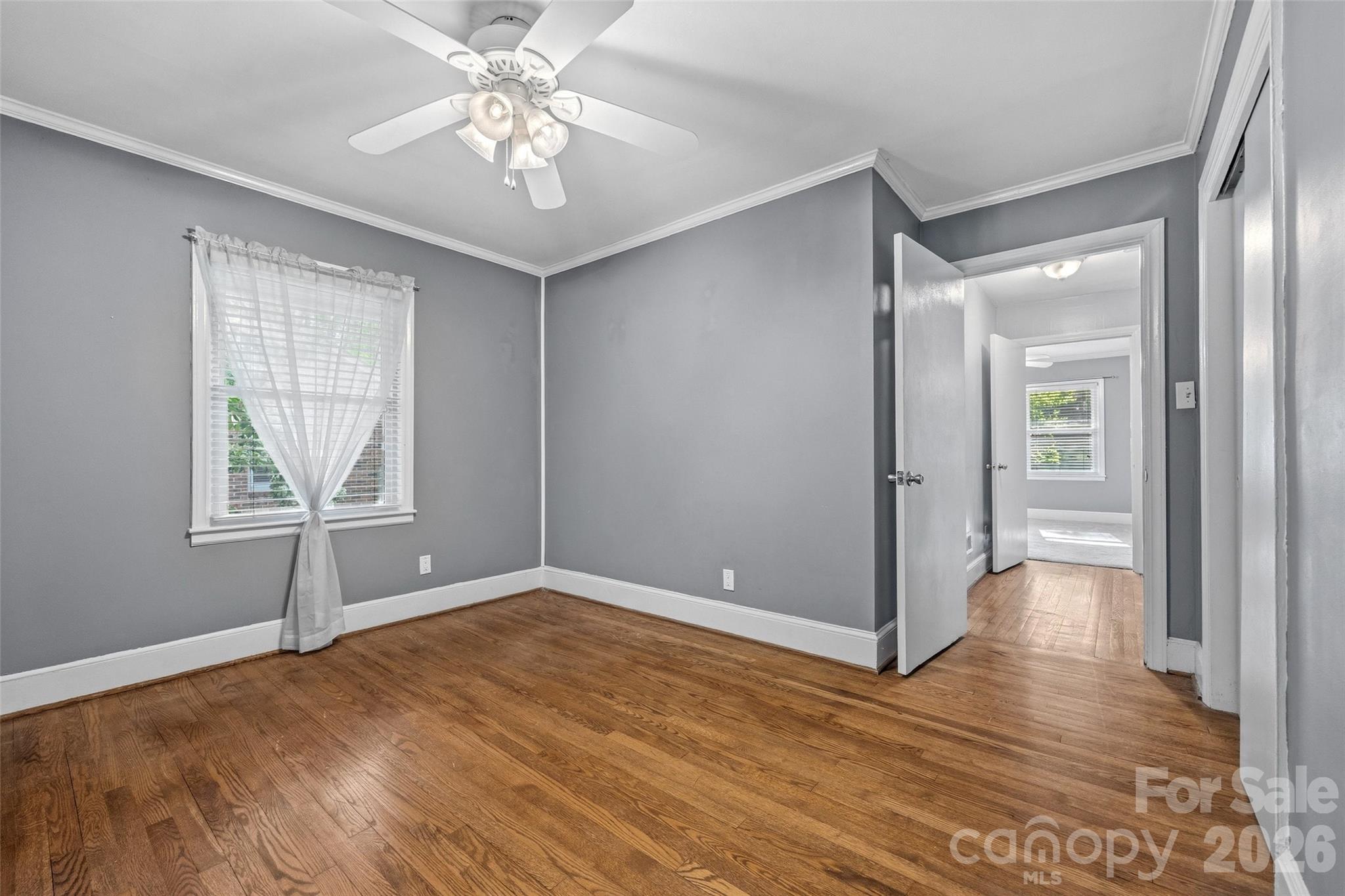 407 Pine Street Fort Mill, SC 29715 - Photo 27 of 45 a view of an empty room with window and wooden floor