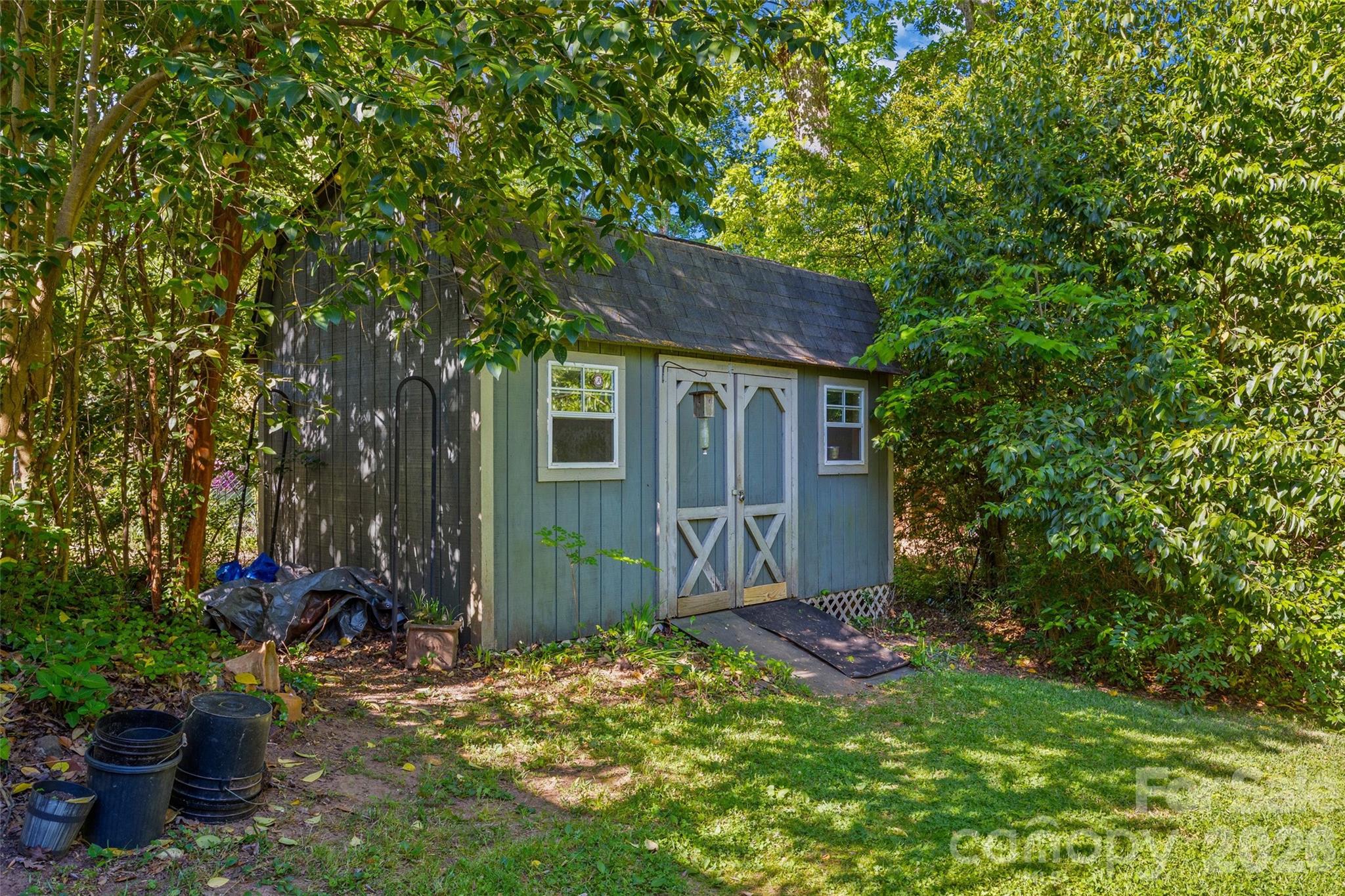 407 Pine Street Fort Mill, SC 29715 - Photo 34 of 45 a view of a backyard with plants and a tree
