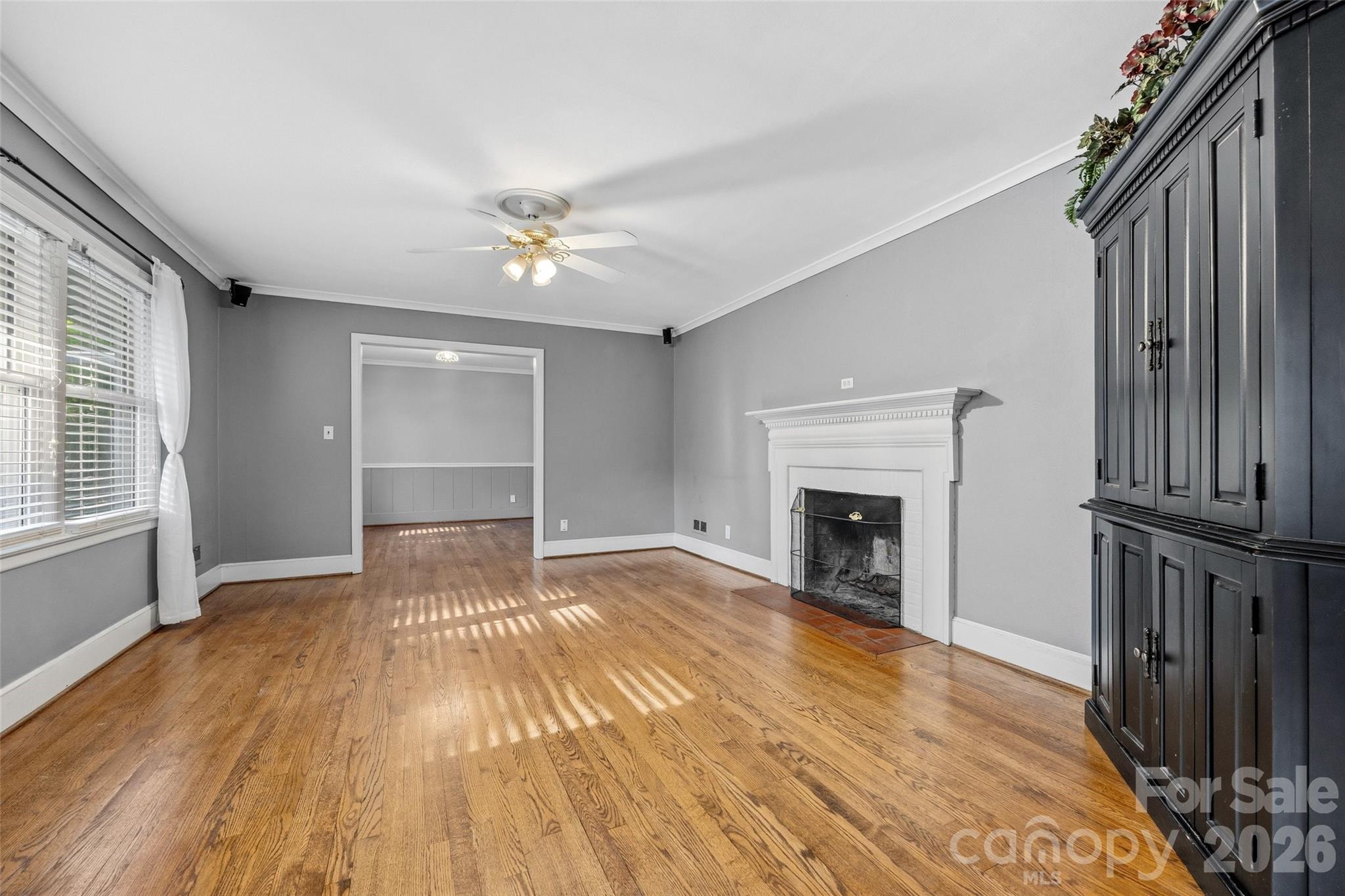407 Pine Street Fort Mill, SC 29715 - Photo 7 of 45 wooden floor fireplace and windows in an empty room