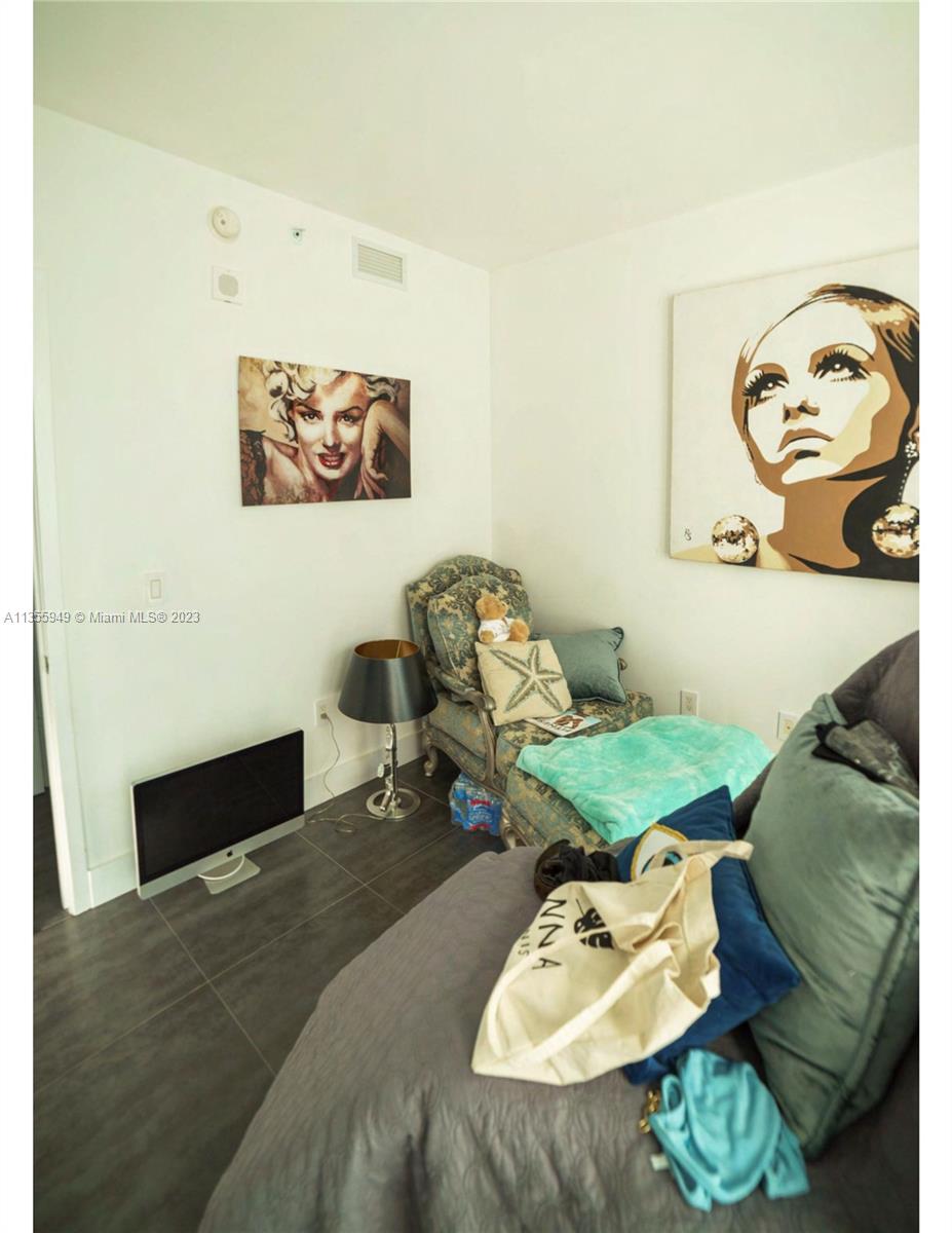 460 Northeast 28th Street, Unit 808 Miami, FL 33137 - Photo 14 of 20 a living room with furniture and a couch