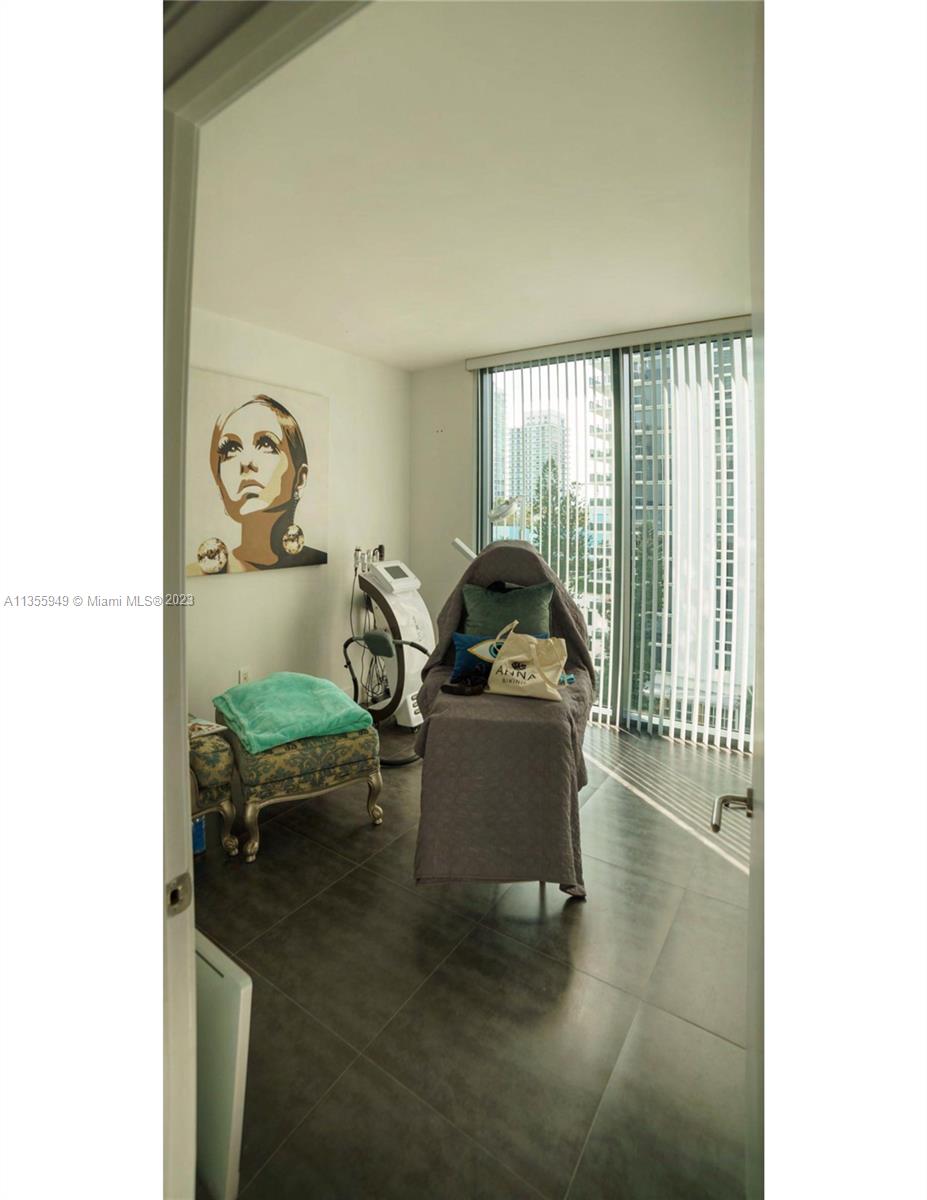460 Northeast 28th Street, Unit 808 Miami, FL 33137 - Photo 15 of 20 a living room with furniture and a window