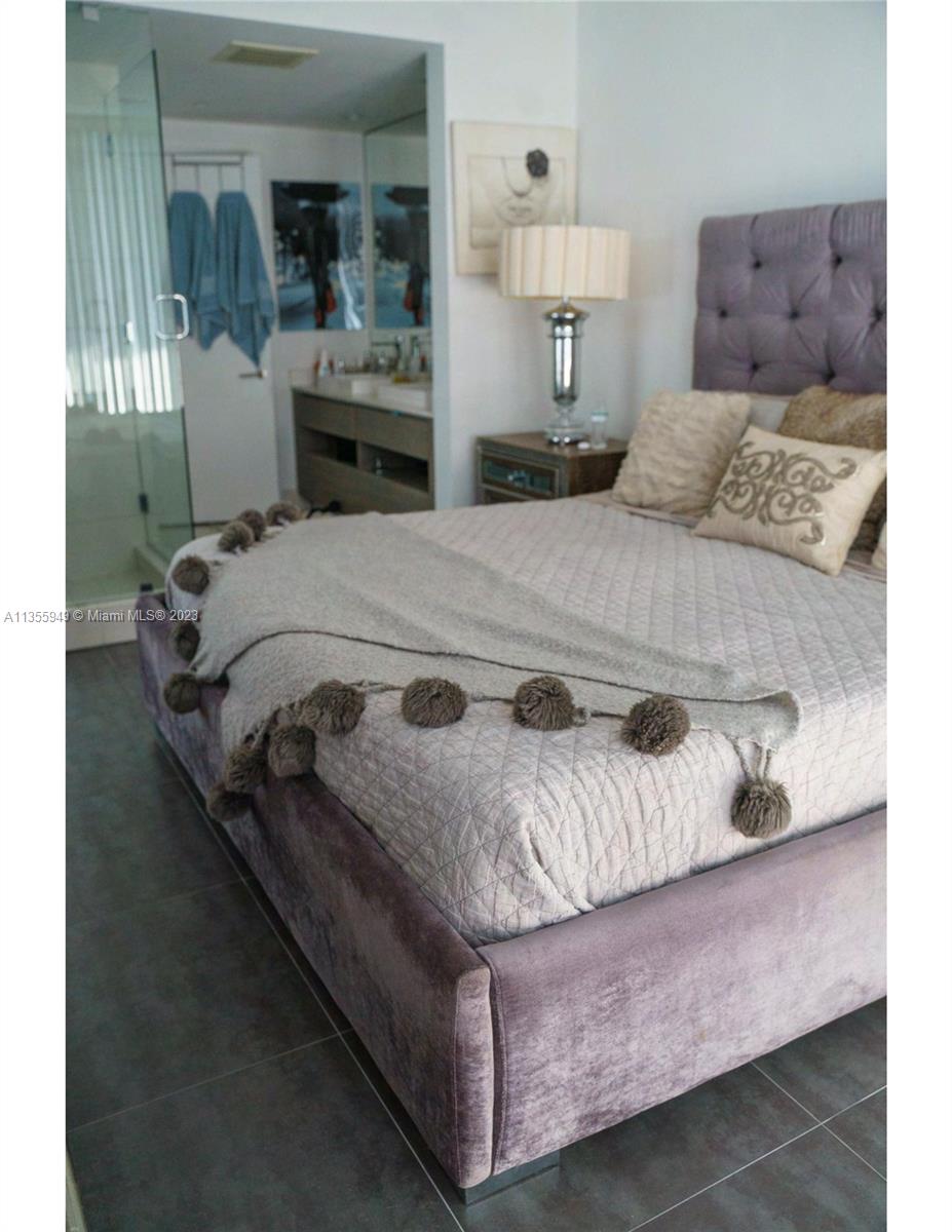 460 Northeast 28th Street, Unit 808 Miami, FL 33137 - Photo 16 of 20 a bedroom with a bed and window