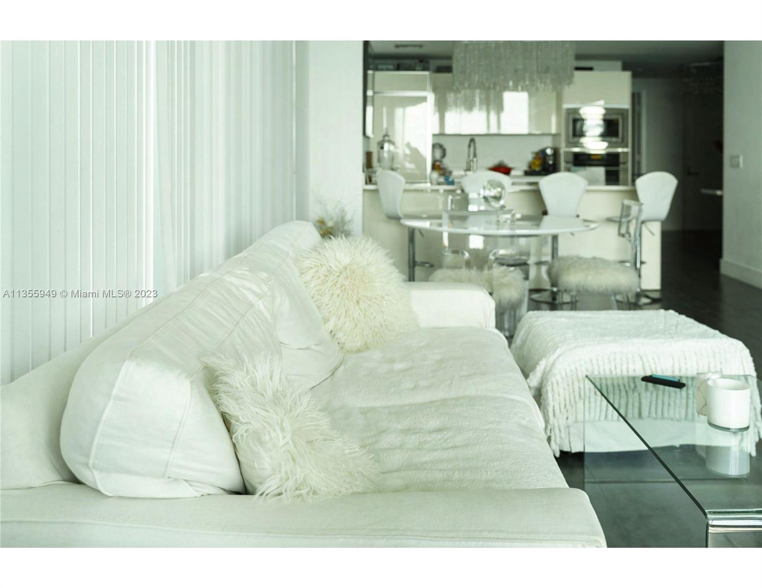 460 Northeast 28th Street, Unit 808 Miami, FL 33137 - Photo 19 of 20 a large white room with lots of white furniture