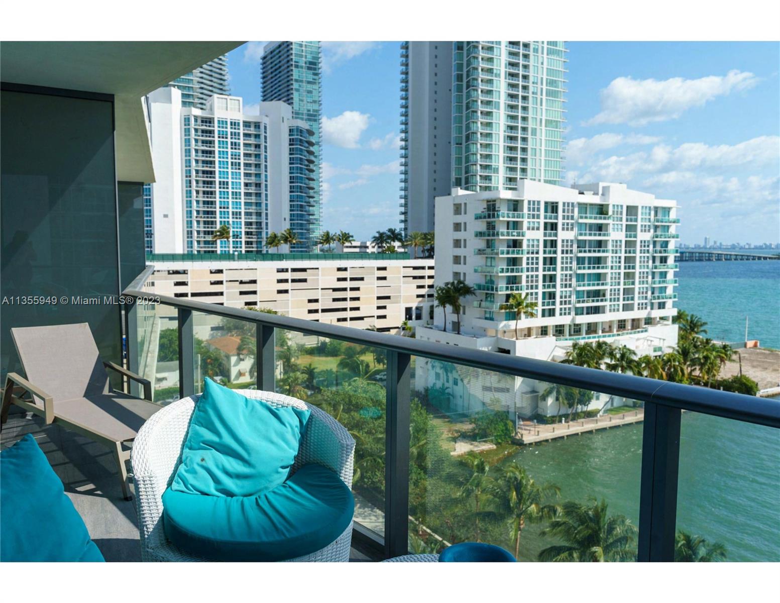 460 Northeast 28th Street, Unit 808 Miami, FL 33137 - Photo 2 of 20 a balcony with table and chairs