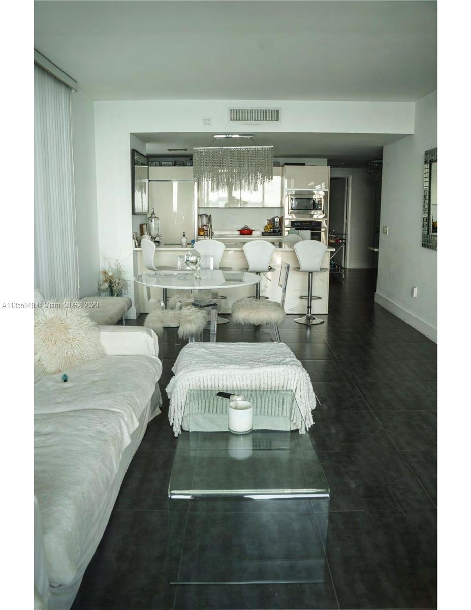 460 Northeast 28th Street, Unit 808 Miami, FL 33137 - Photo 6 of 20 a en suite bathroom with a sink and mirror