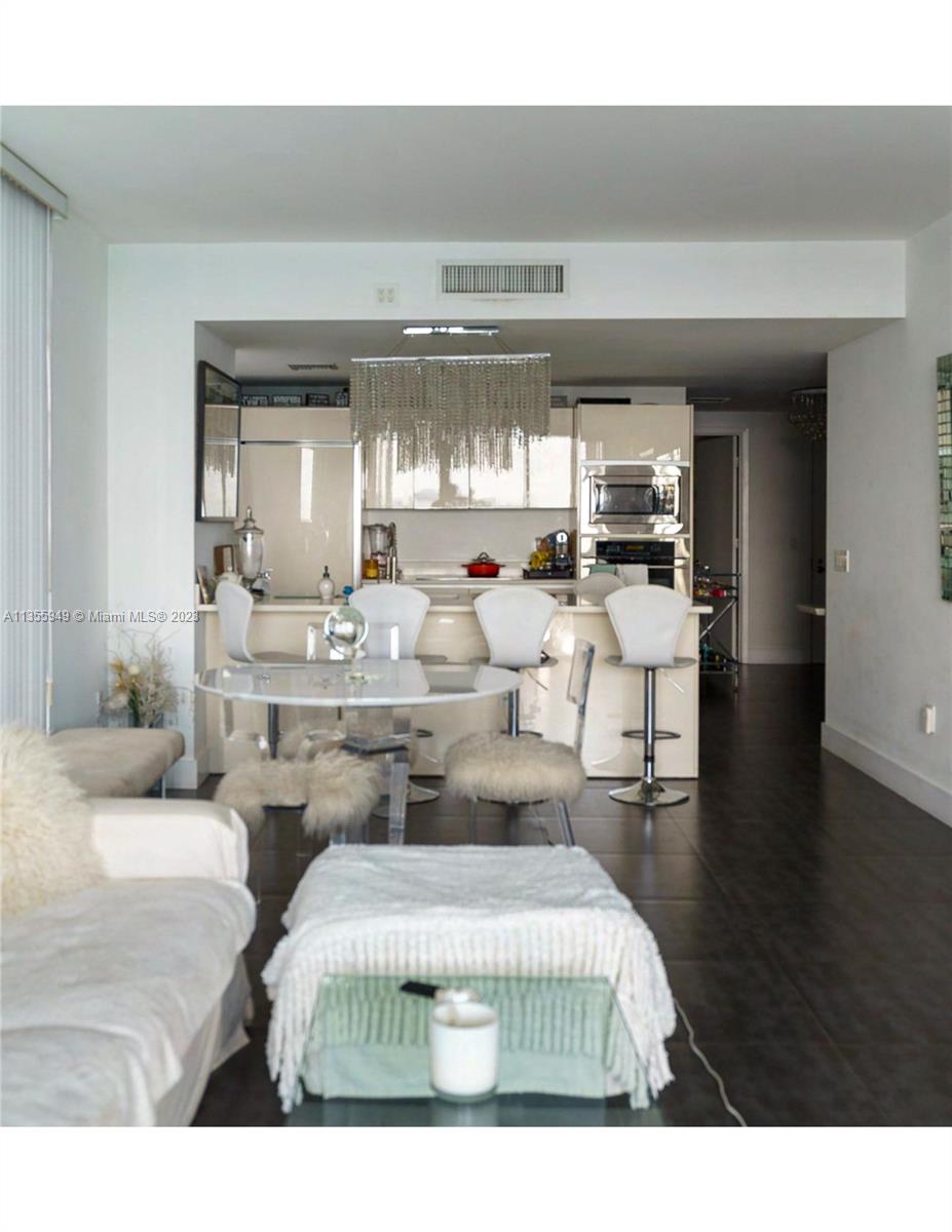 460 Northeast 28th Street, Unit 808 Miami, FL 33137 - Photo 8 of 20 a living room with furniture and a large window