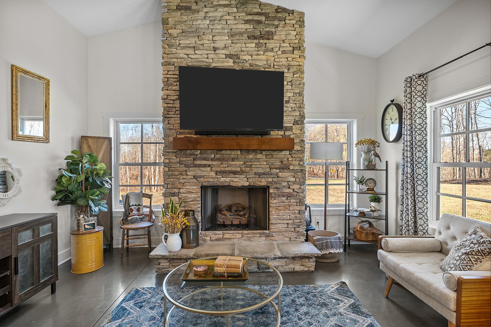 1319 Petty Road White Bluff, TN 37187 - Photo 12 of 45 a living room with furniture a flat screen tv and a fireplace