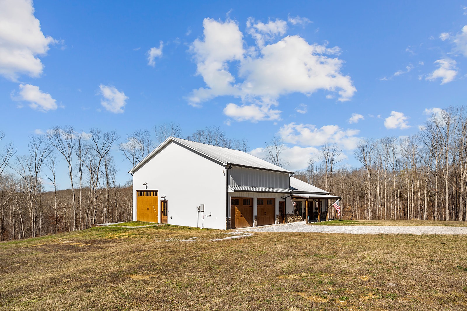1319 Petty Road White Bluff, TN 37187 - Photo 30 of 45 a front view of a house with a yard and garage