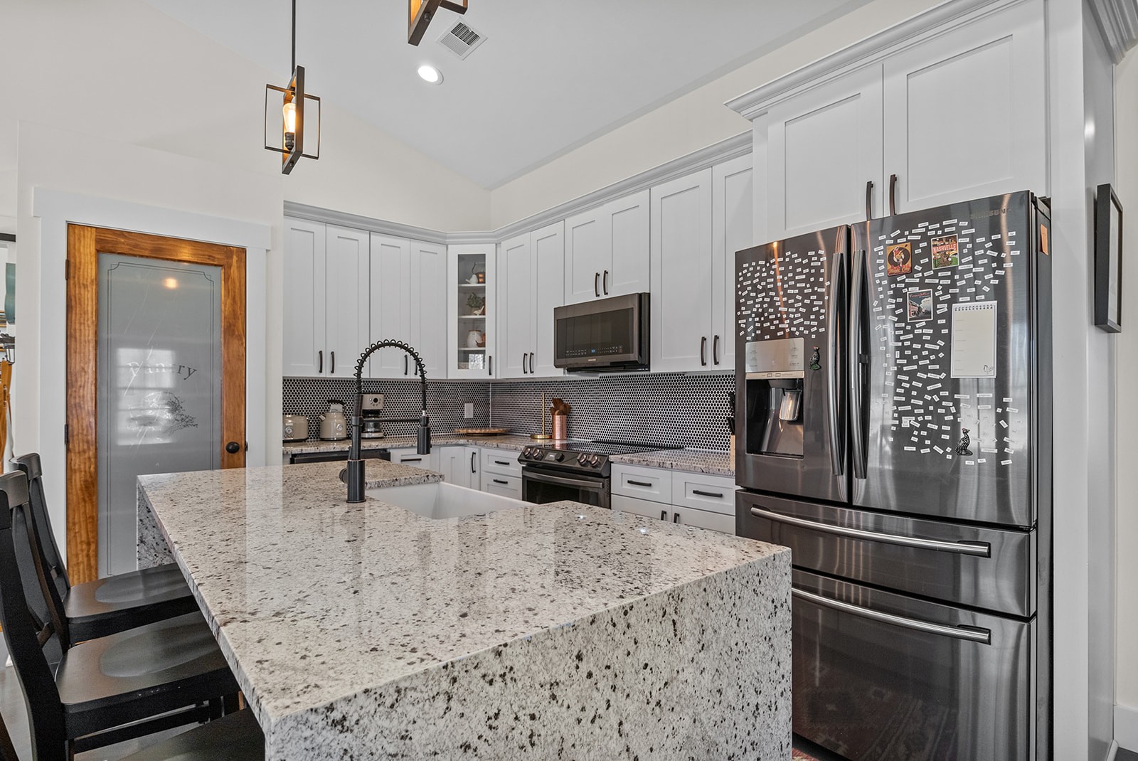 1319 Petty Road White Bluff, TN 37187 - Photo 7 of 45 a kitchen with granite countertop a refrigerator stove and microwave