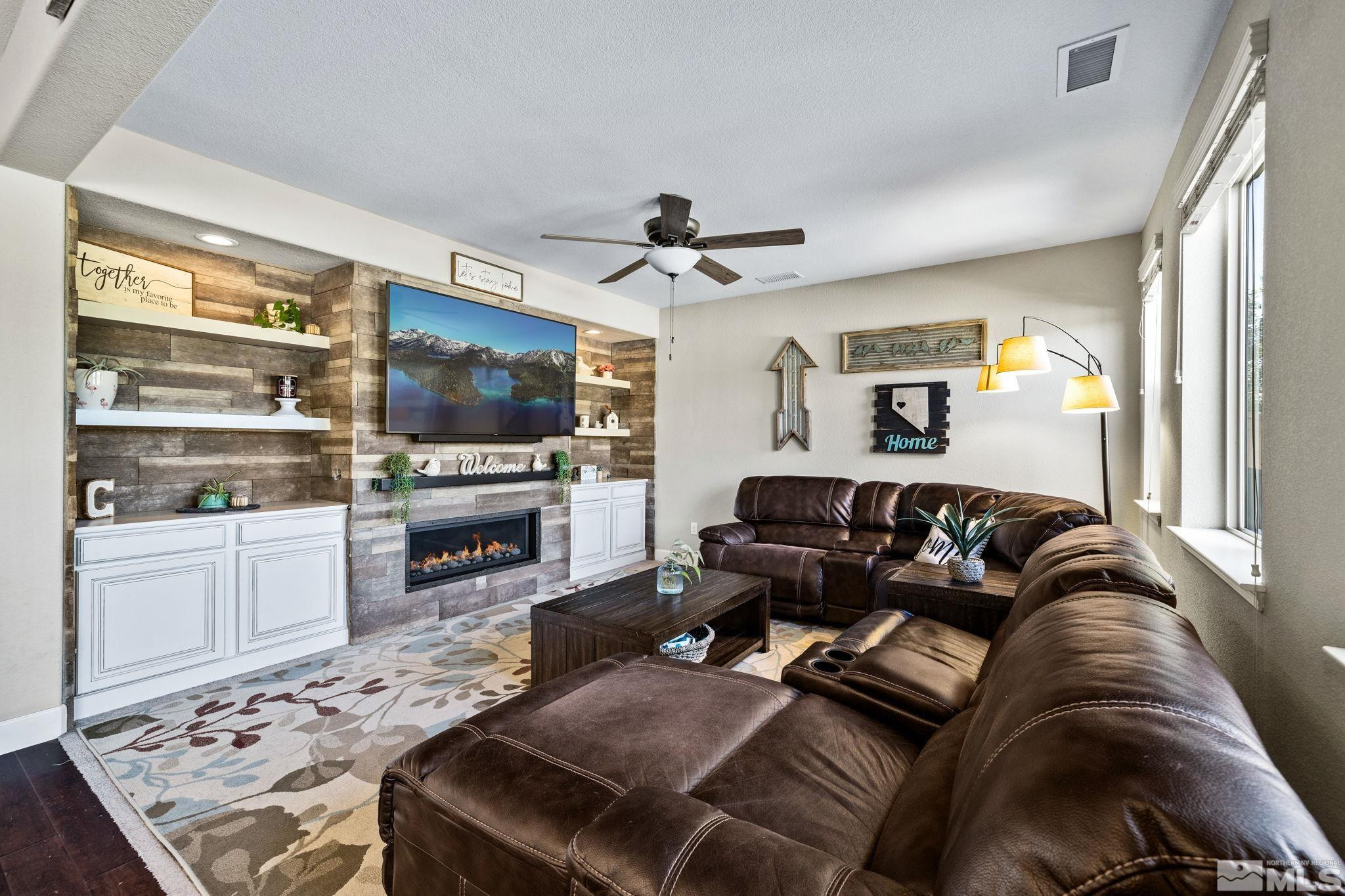 1735 Samantha Crest Trail Reno, NV 89523 - Photo 11 of 32 a living room with furniture and a flat screen tv