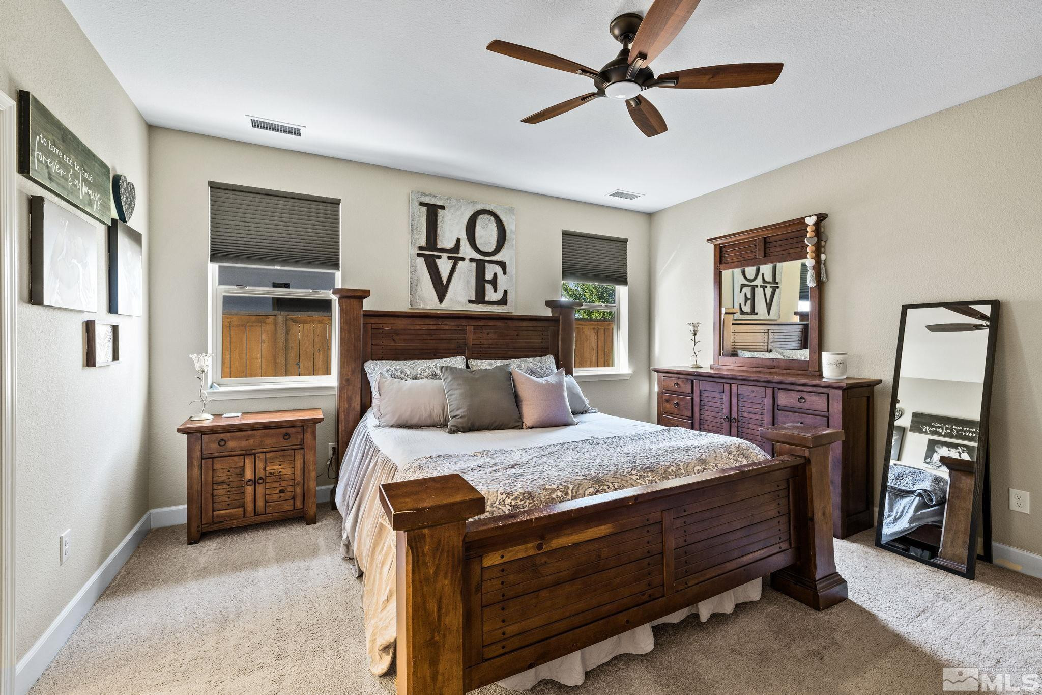 1735 Samantha Crest Trail Reno, NV 89523 - Photo 13 of 32 a bedroom with a bed dresser and a window