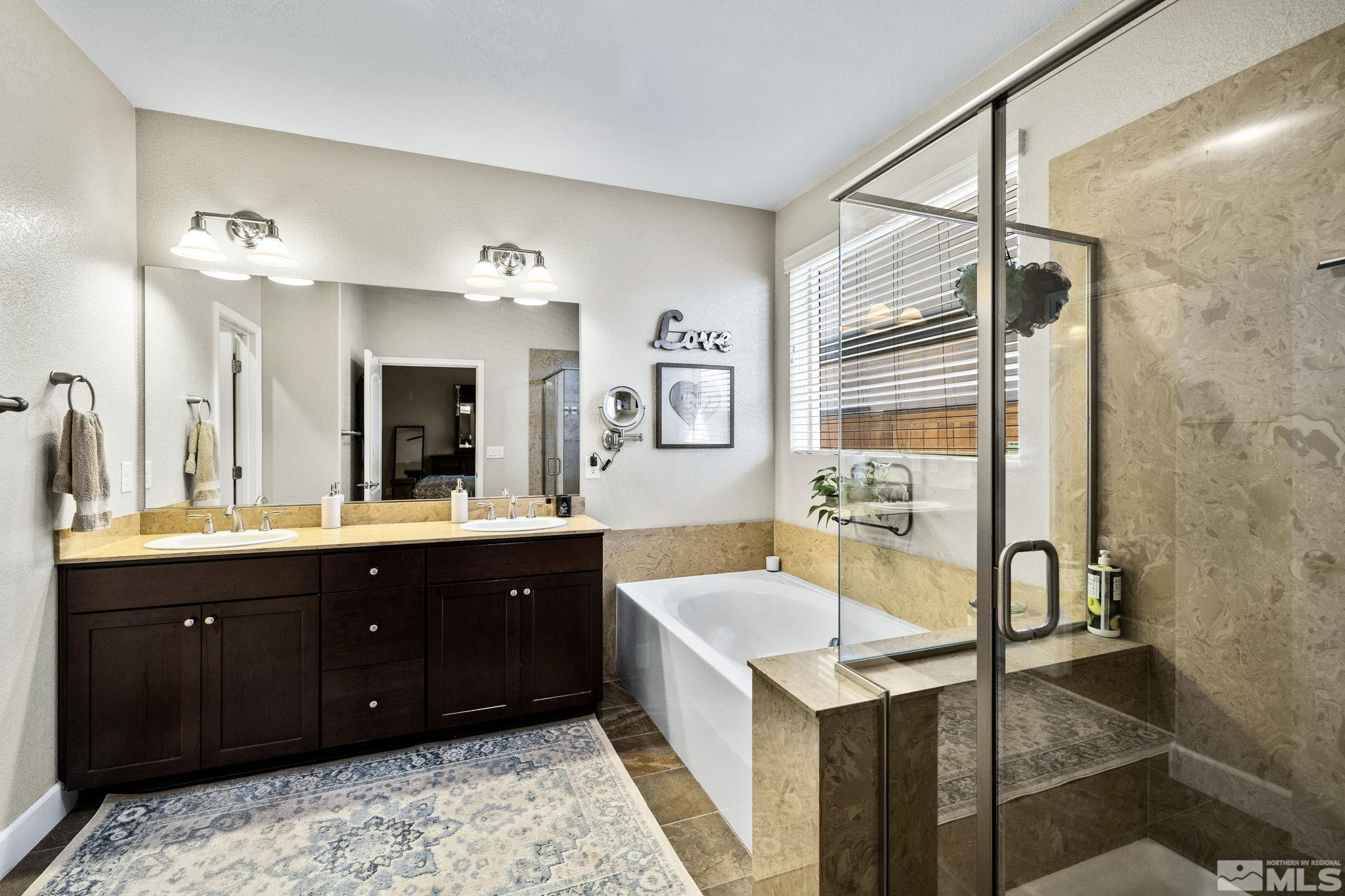1735 Samantha Crest Trail Reno, NV 89523 - Photo 15 of 32 a spacious bathroom with a tub sink shower and mirror