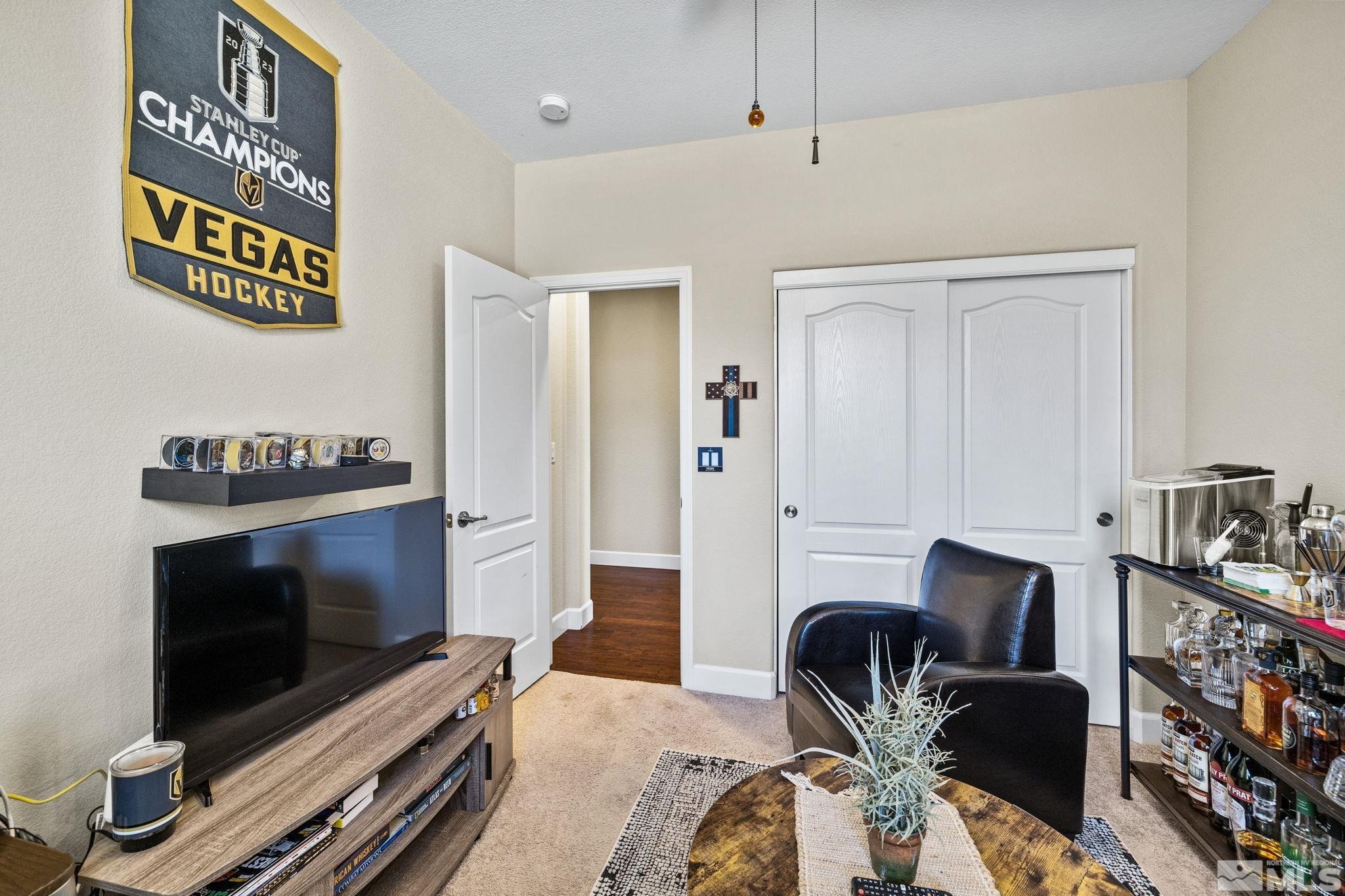1735 Samantha Crest Trail Reno, NV 89523 - Photo 18 of 32 a living room with furniture and a flat screen tv