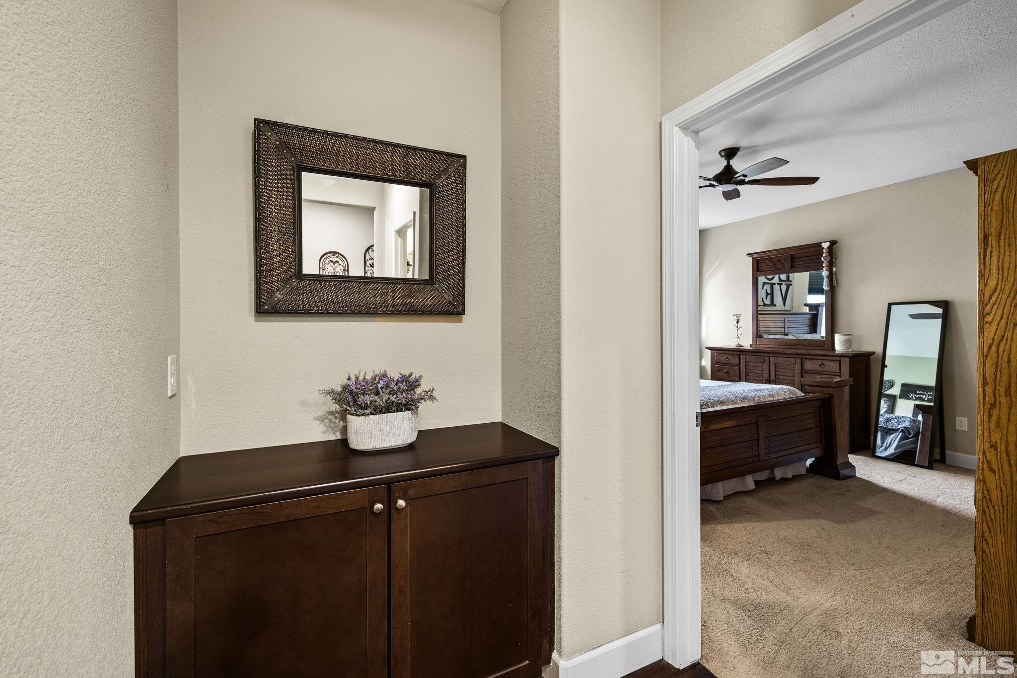 1735 Samantha Crest Trail Reno, NV 89523 - Photo 20 of 32 a bedroom with a bed and a chandelier