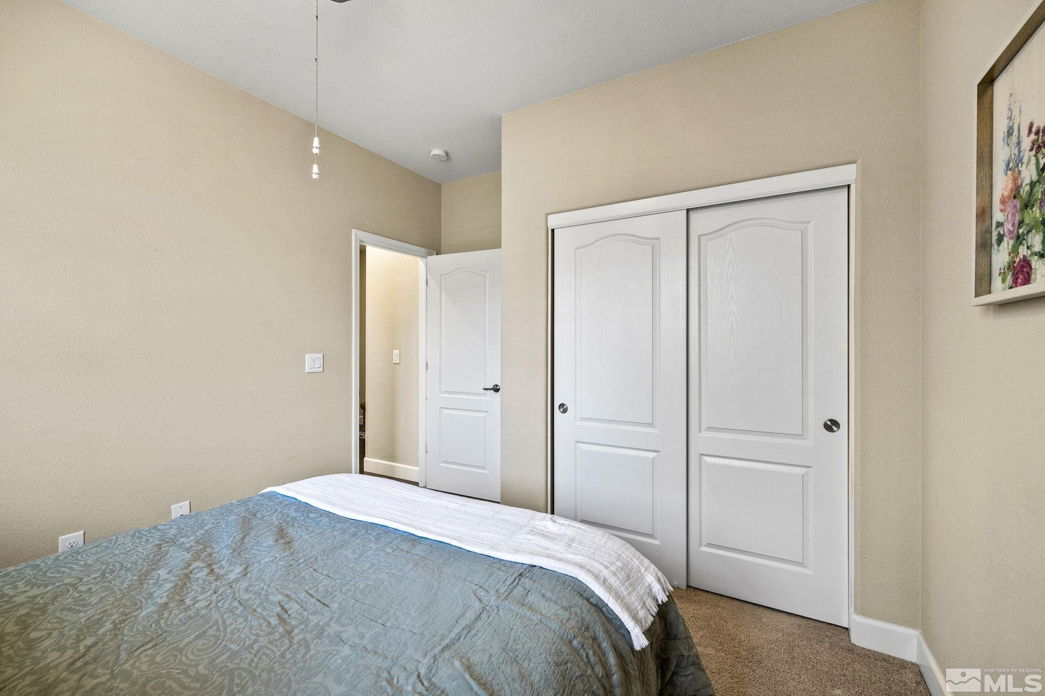 1735 Samantha Crest Trail Reno, NV 89523 - Photo 22 of 32 a bedroom with a bed and a window