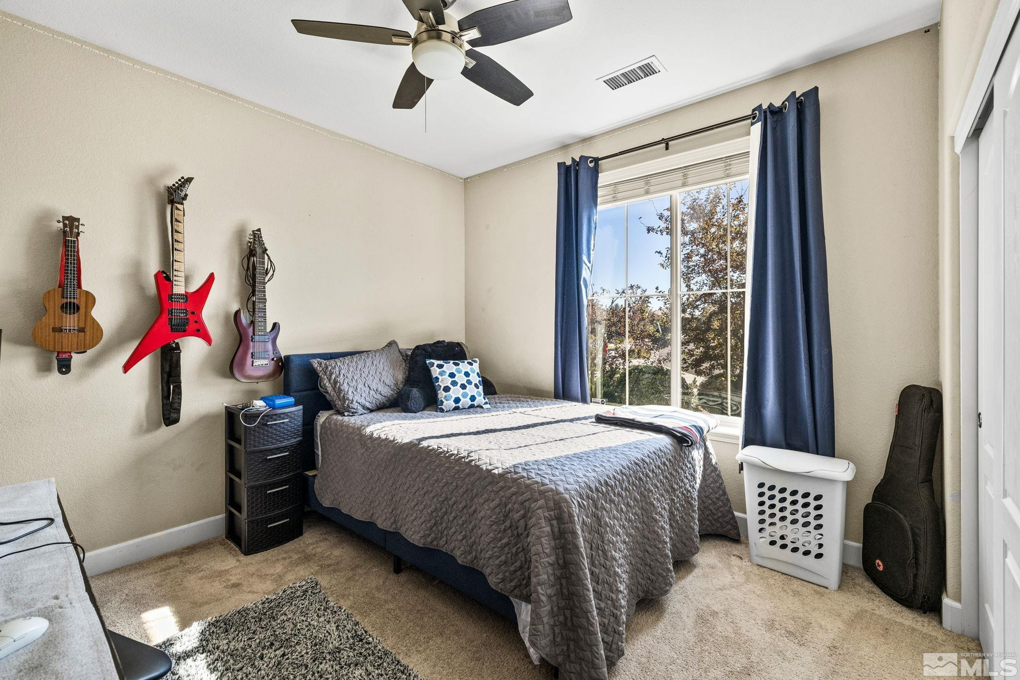 1735 Samantha Crest Trail Reno, NV 89523 - Photo 24 of 32 a bedroom with a bed and a large window
