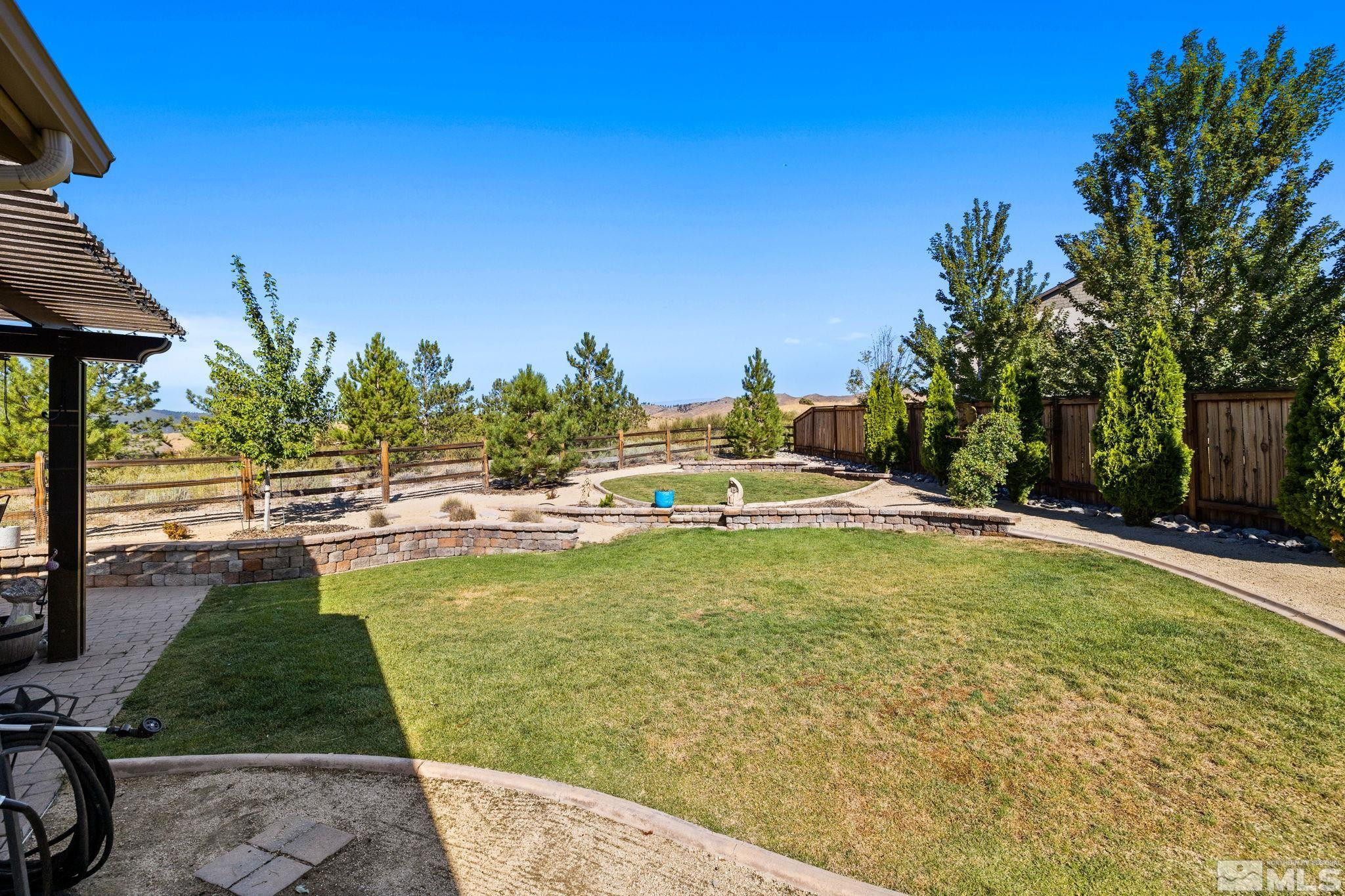 1735 Samantha Crest Trail Reno, NV 89523 - Photo 30 of 32 a view of a swimming pool with a patio
