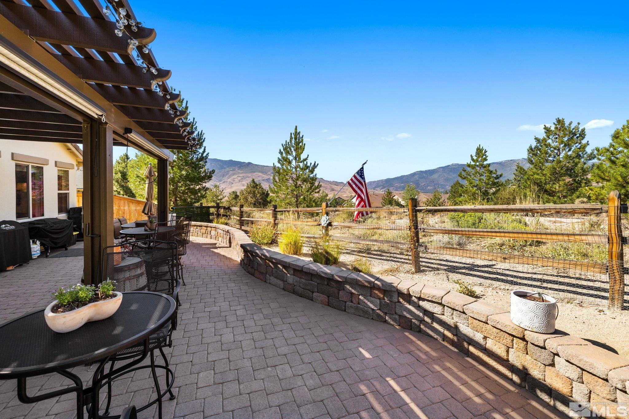1735 Samantha Crest Trail Reno, NV 89523 - Photo 32 of 32 a view of a balcony with chairs and potted plants