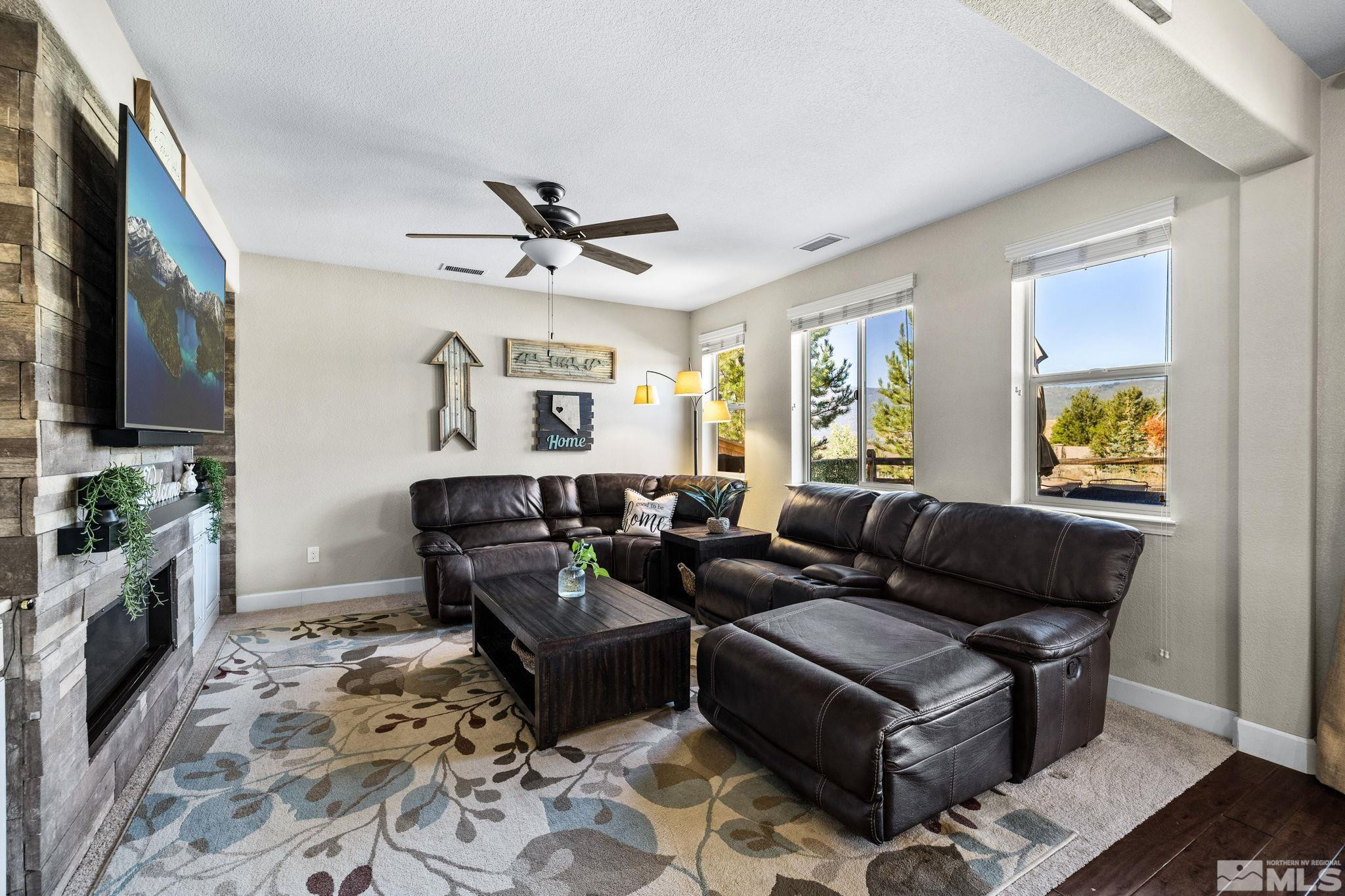 1735 Samantha Crest Trail Reno, NV 89523 - Photo 8 of 32 a living room with furniture and a flat screen tv
