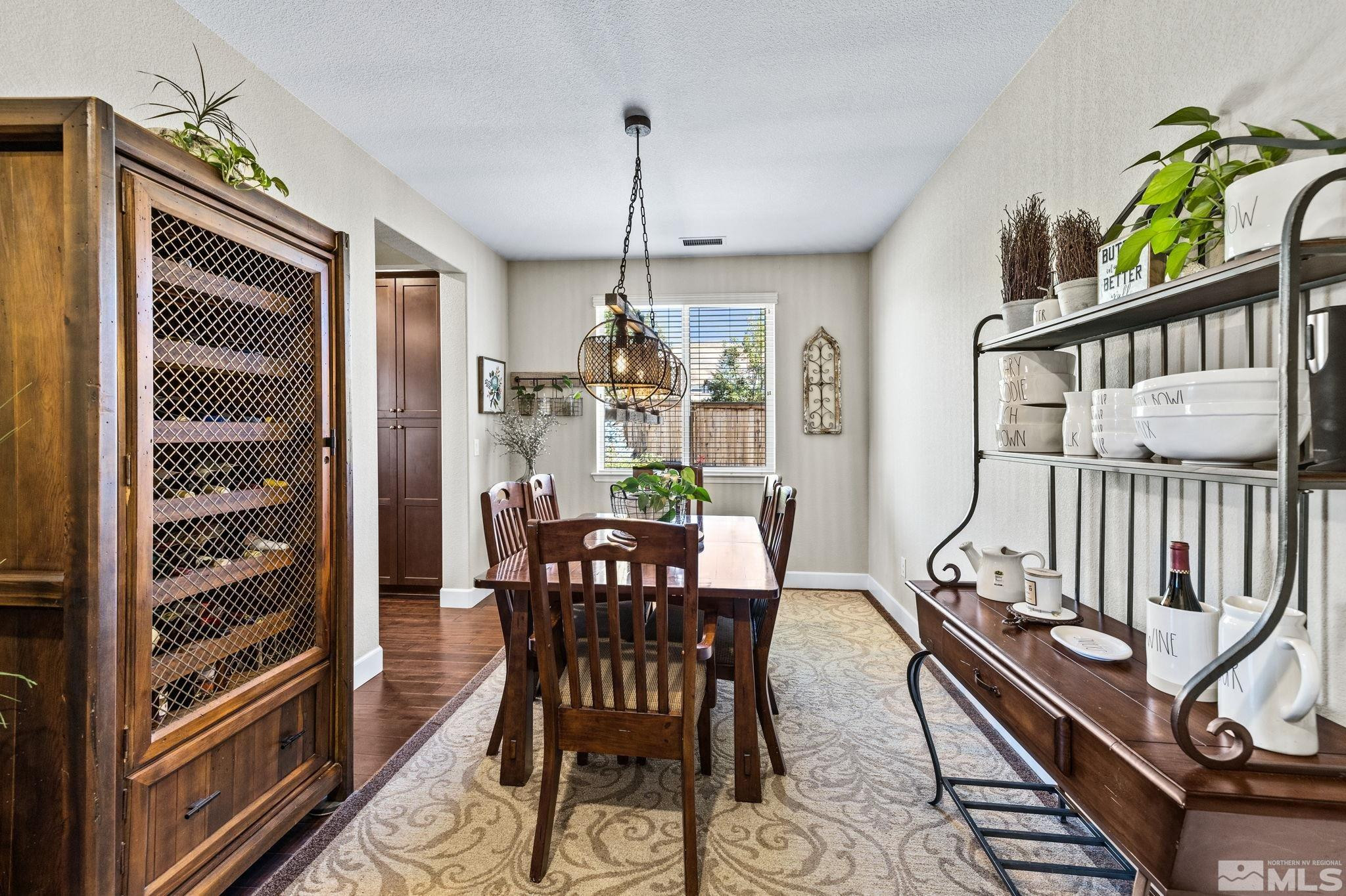 1735 Samantha Crest Trail Reno, NV 89523 - Photo 10 of 32 a view of a dining room with furniture window and wooden floor