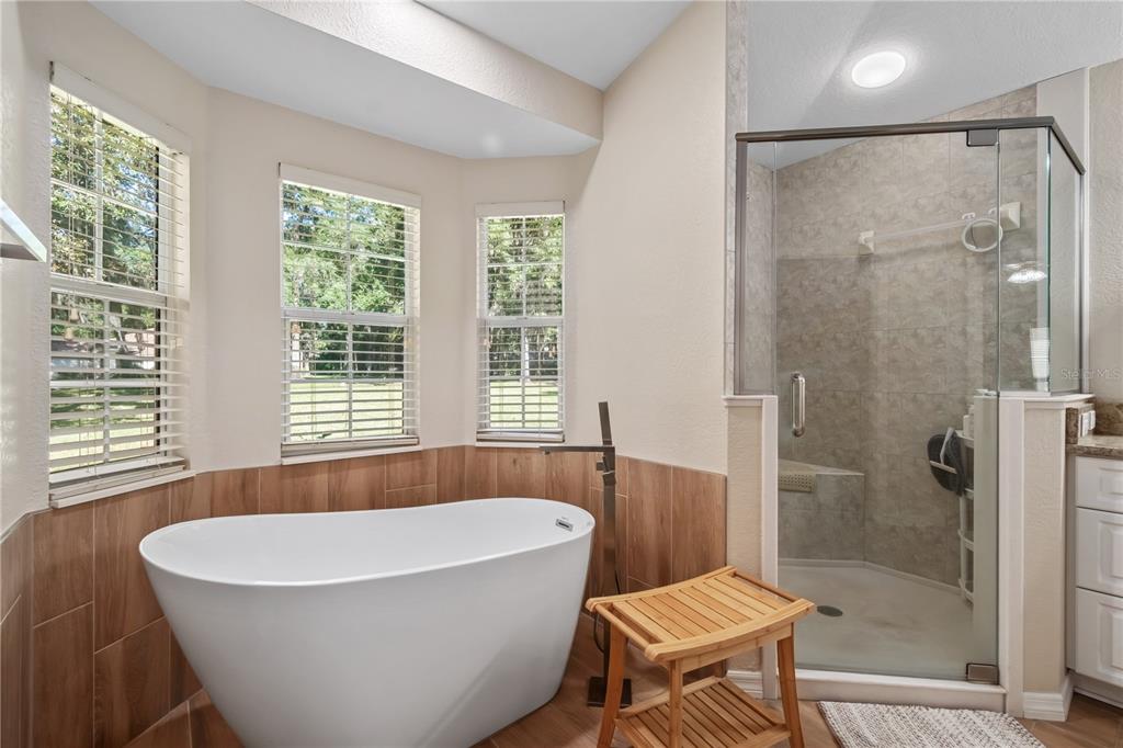 1969 Northwest 111th Loop Ocala, FL 34475 - Photo 41 of 48 a bathroom with a bathtub and a shower