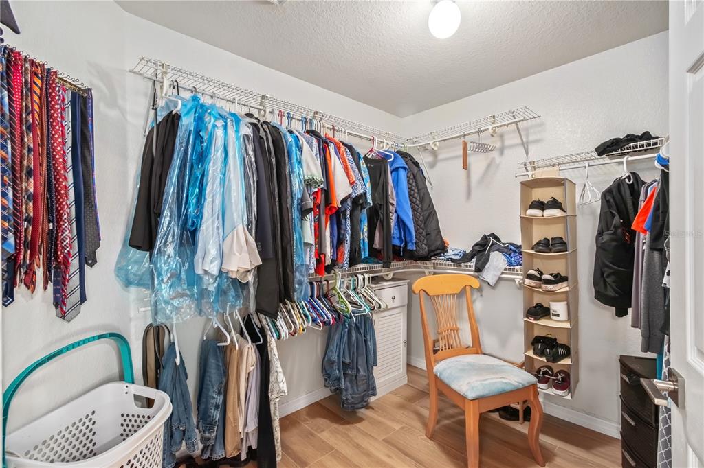 1969 Northwest 111th Loop Ocala, FL 34475 - Photo 42 of 48 a view of walk in closet with clothes and shoes