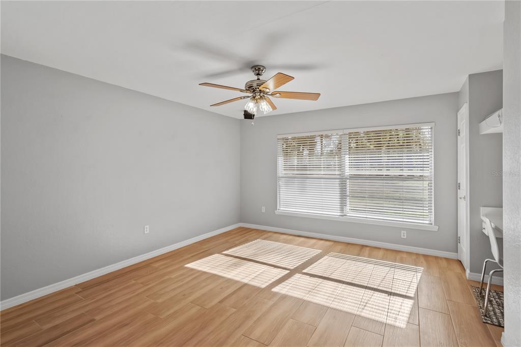 1969 Northwest 111th Loop Ocala, FL 34475 - Photo 43 of 48 a view of a room with a ceiling fan and a window