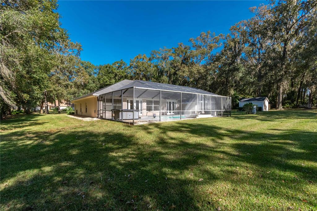 1969 Northwest 111th Loop Ocala, FL 34475 - Photo 7 of 48 a view of a house with a big yard