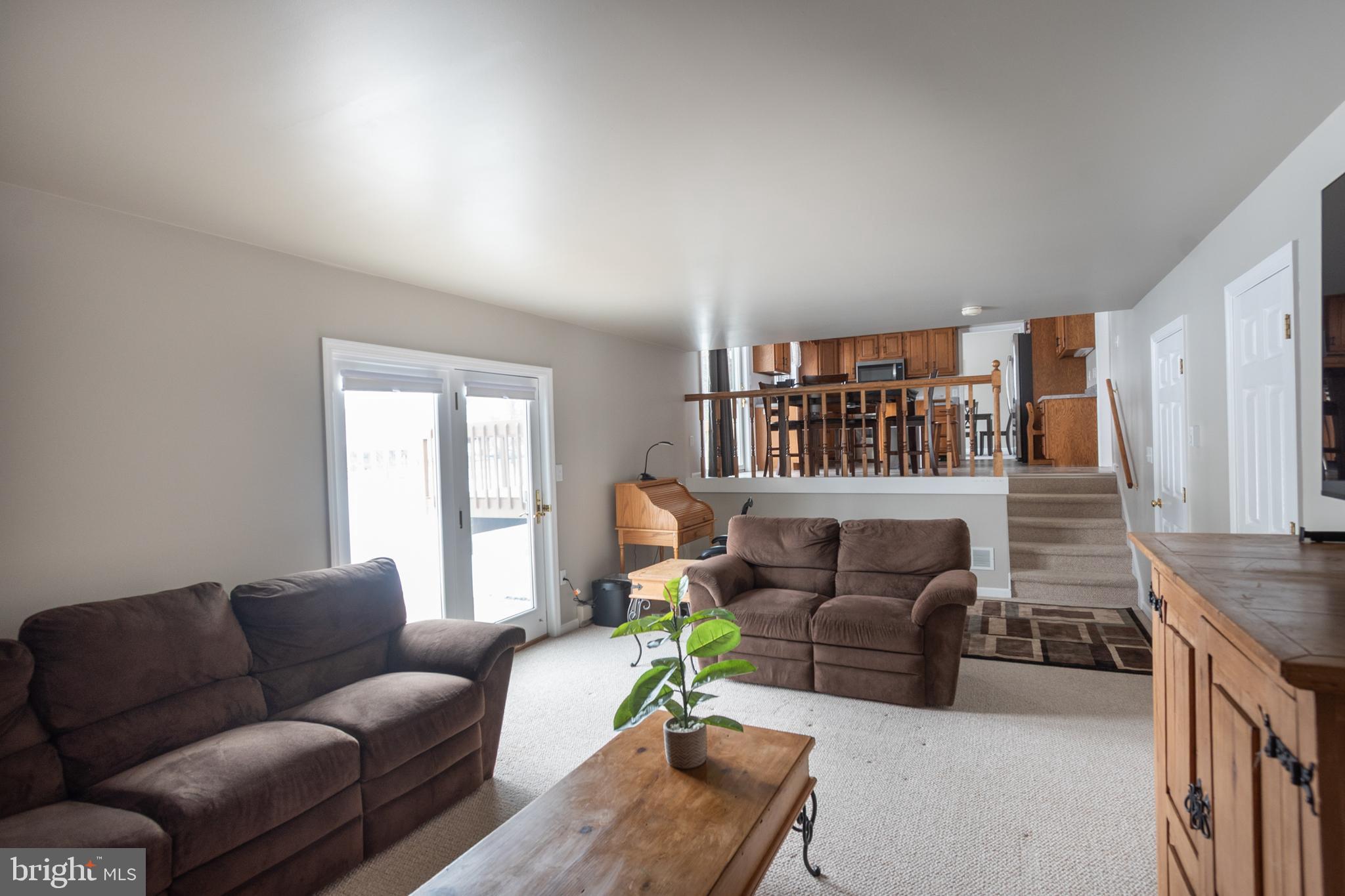 1469 Chaumont Avenue State College, PA 16801 - Photo 14 of 50 a living room with furniture a couch and a bookshelf with wooden floor