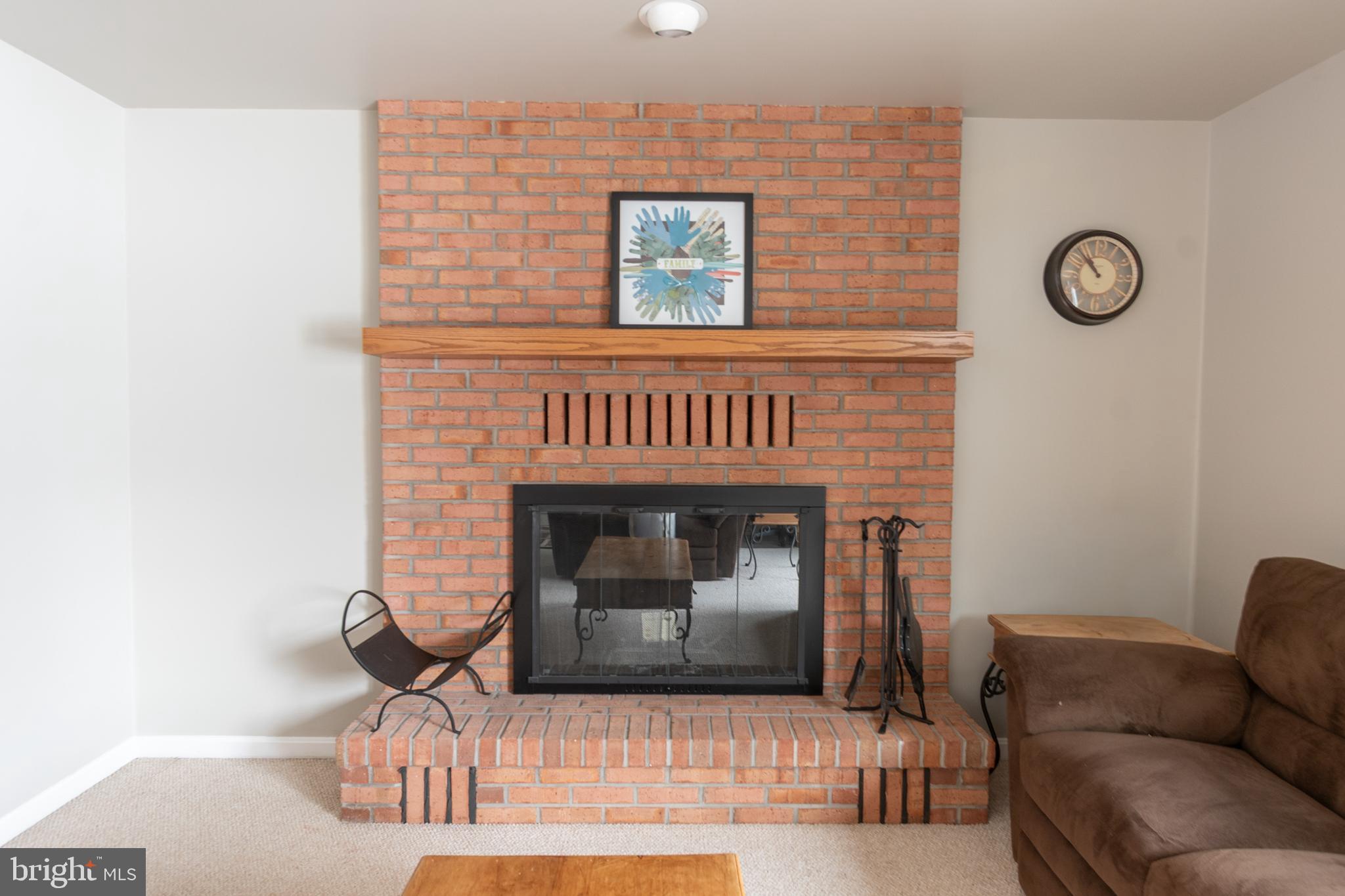 1469 Chaumont Avenue State College, PA 16801 - Photo 17 of 50 a living room with furniture and a fireplace