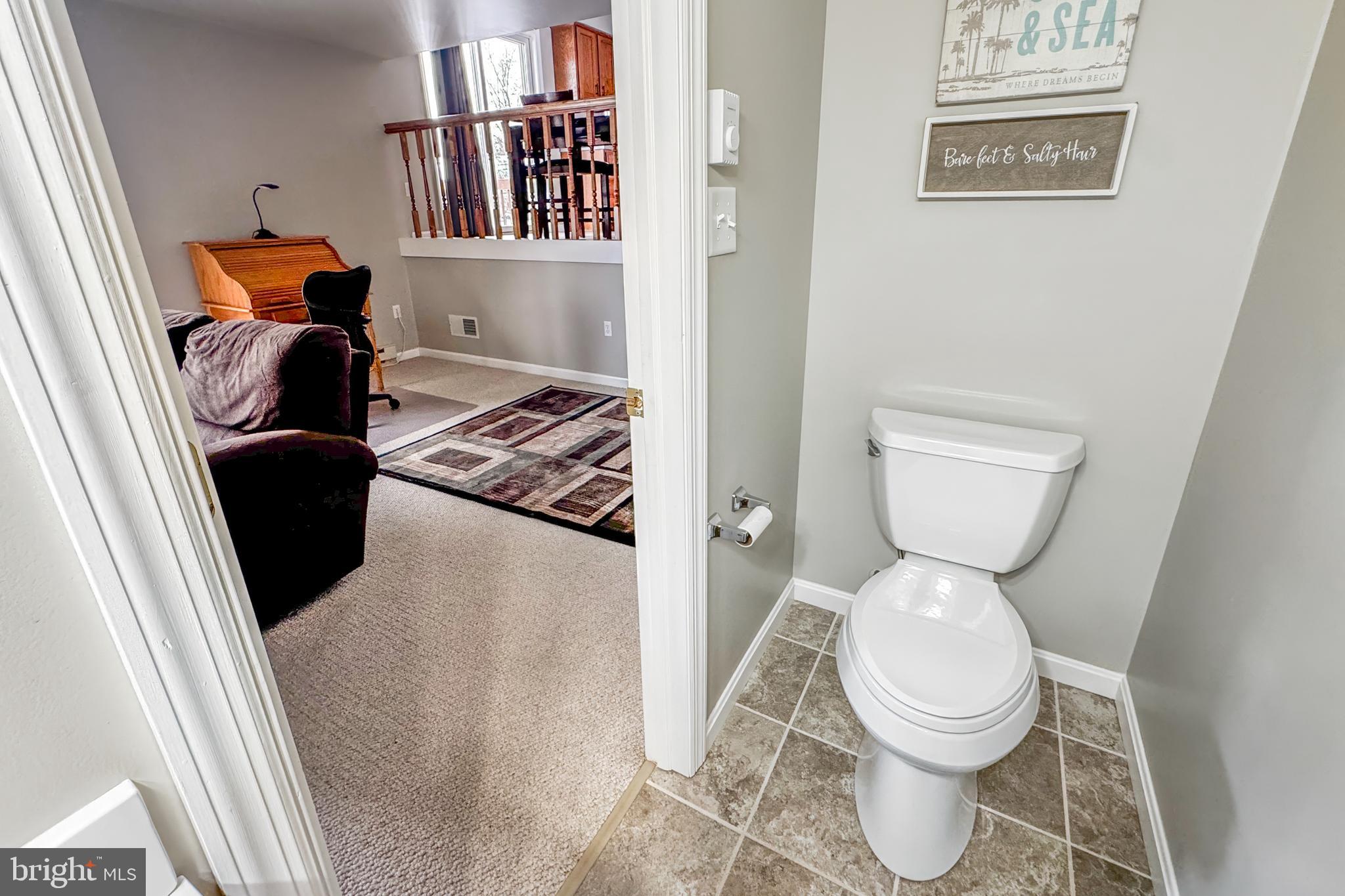 1469 Chaumont Avenue State College, PA 16801 - Photo 18 of 50 a living room with furniture and a toilet