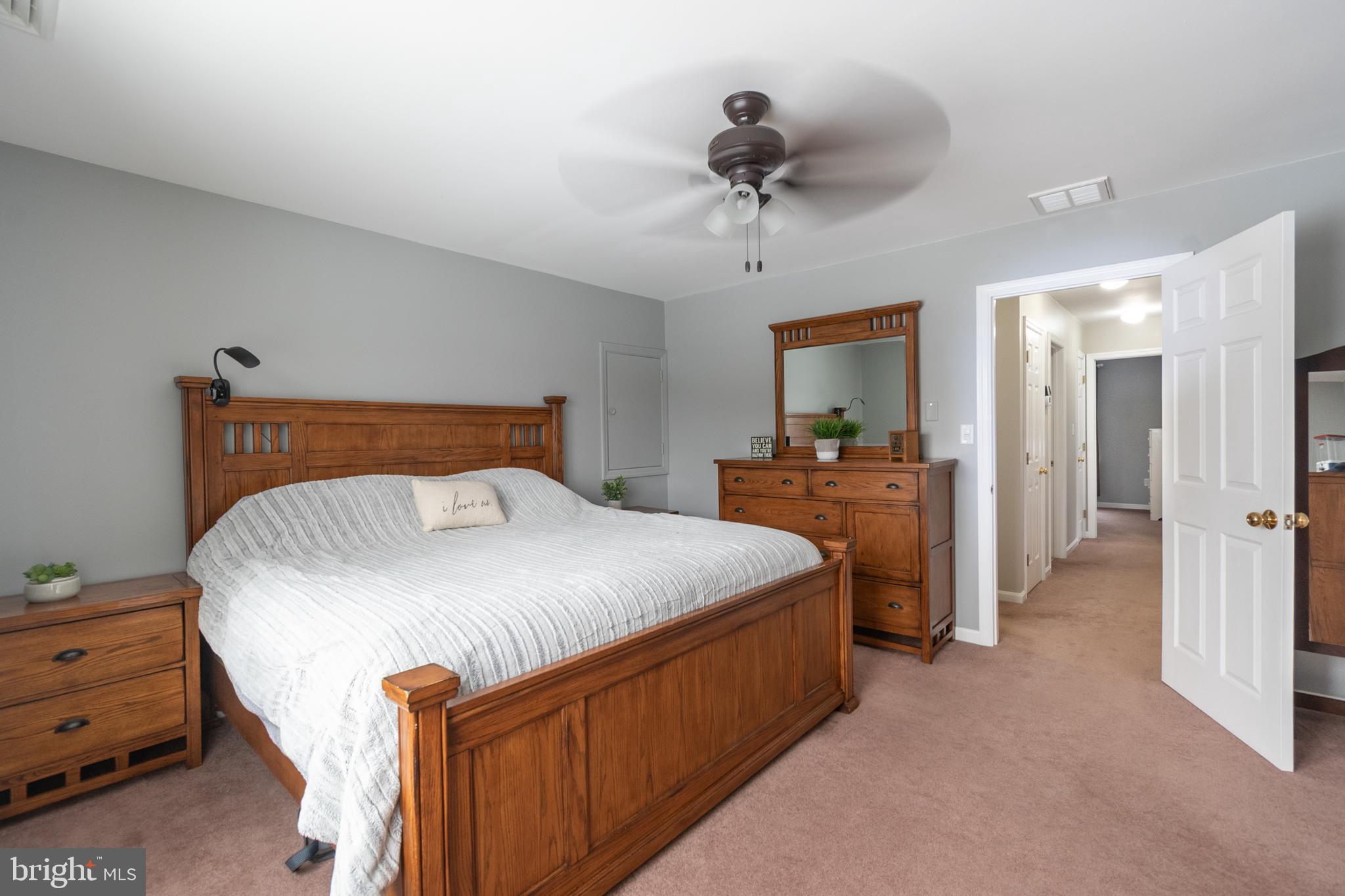 1469 Chaumont Avenue State College, PA 16801 - Photo 24 of 50 a bedroom with a bed and a chandelier