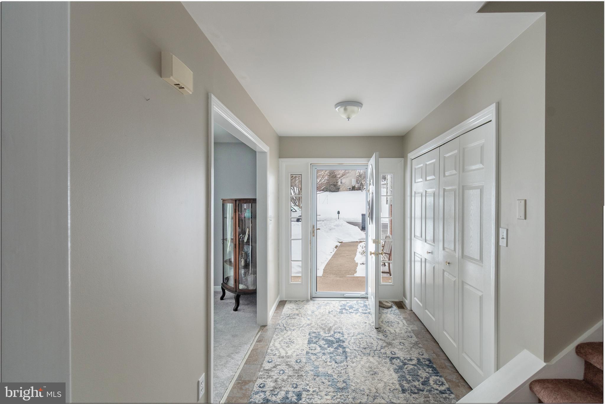 1469 Chaumont Avenue State College, PA 16801 - Photo 3 of 50 a view of a hallway with wooden floor and a bathroom