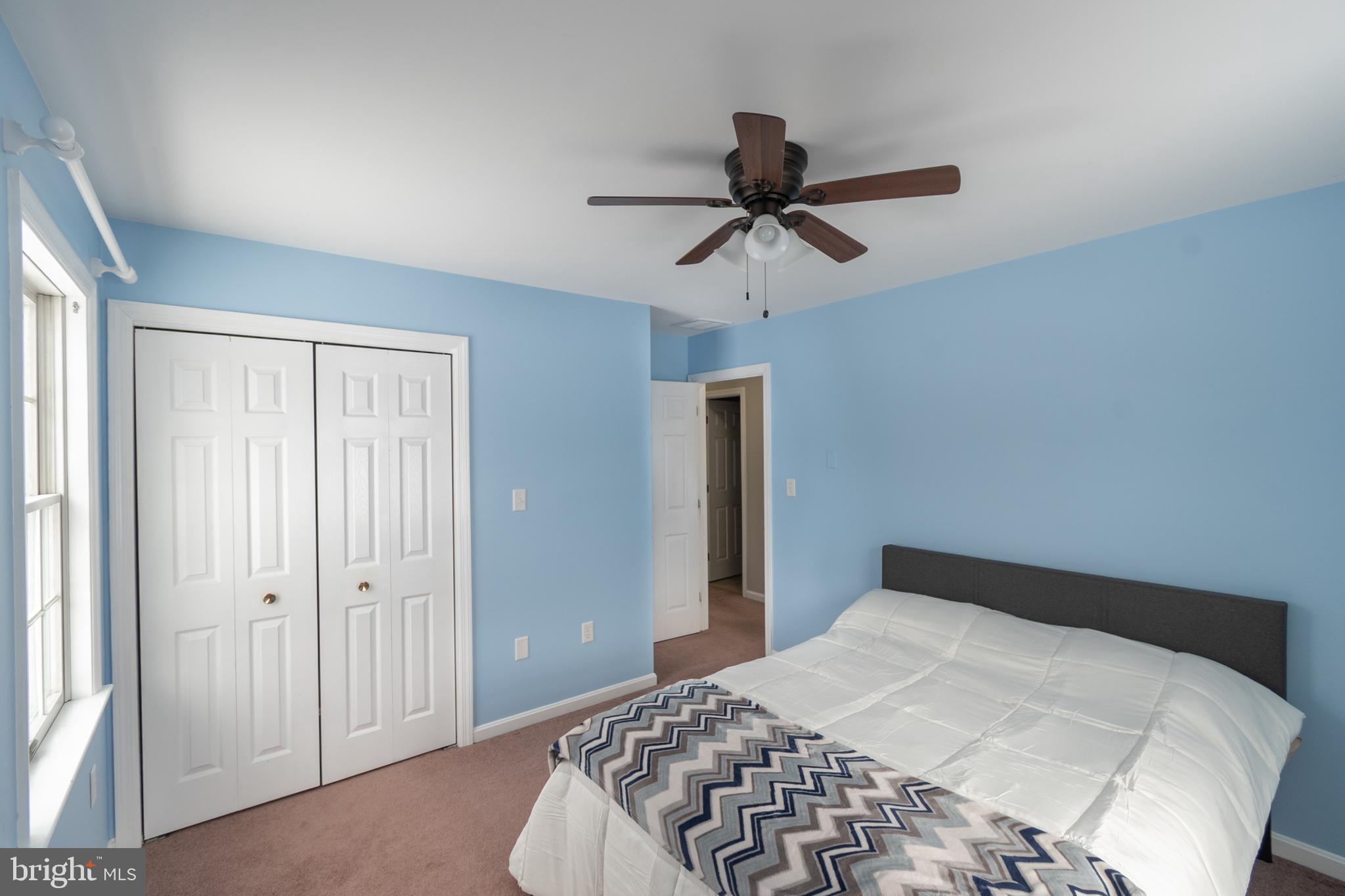 1469 Chaumont Avenue State College, PA 16801 - Photo 33 of 50 a bedroom with a bed and a chandelier