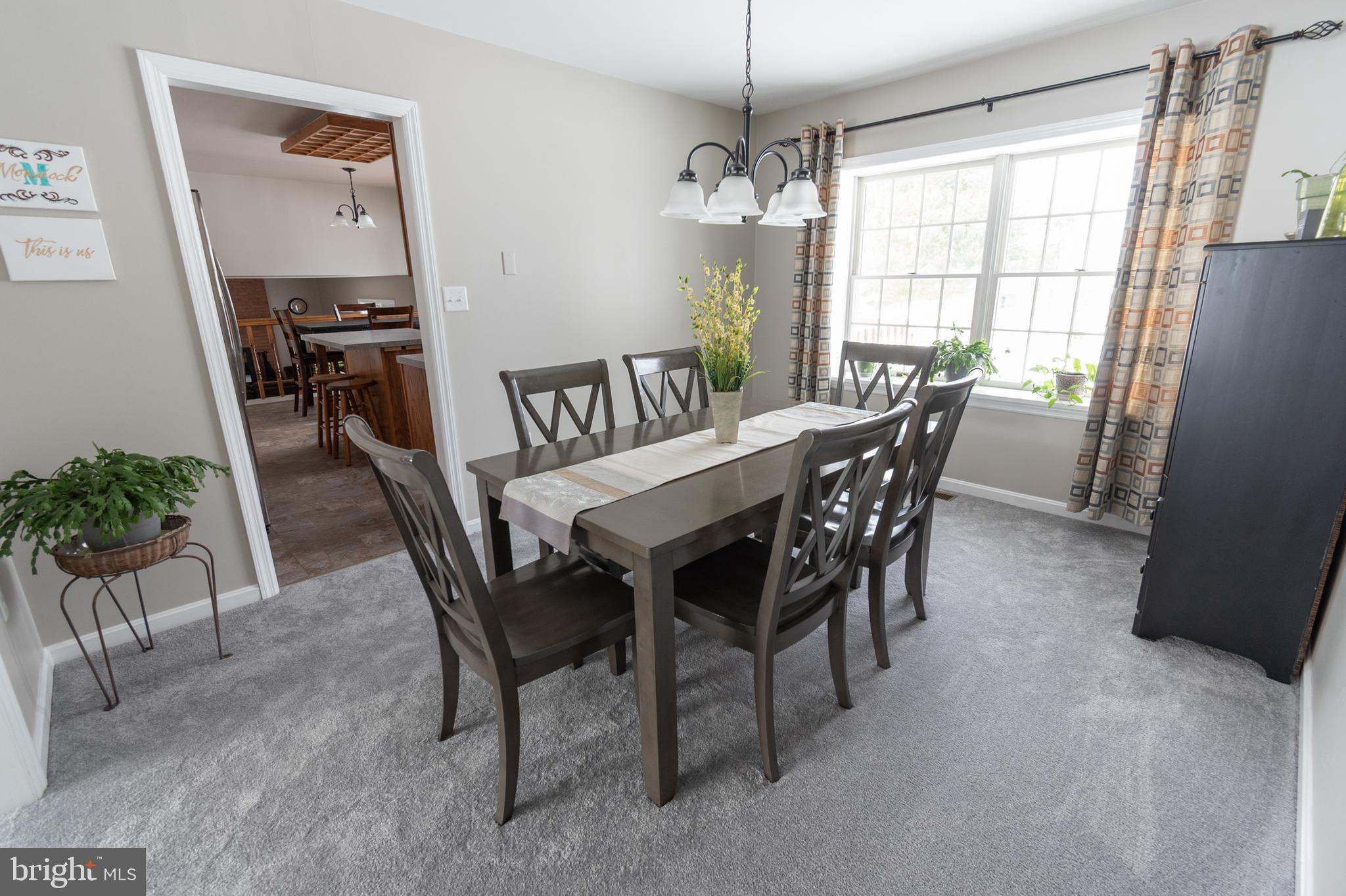 1469 Chaumont Avenue State College, PA 16801 - Photo 8 of 50 a view of a dining room with furniture window and wooden floor