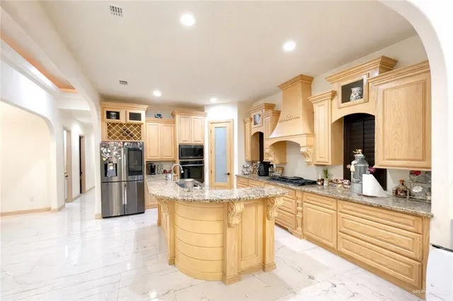 a view of a living room kitchen and a large window